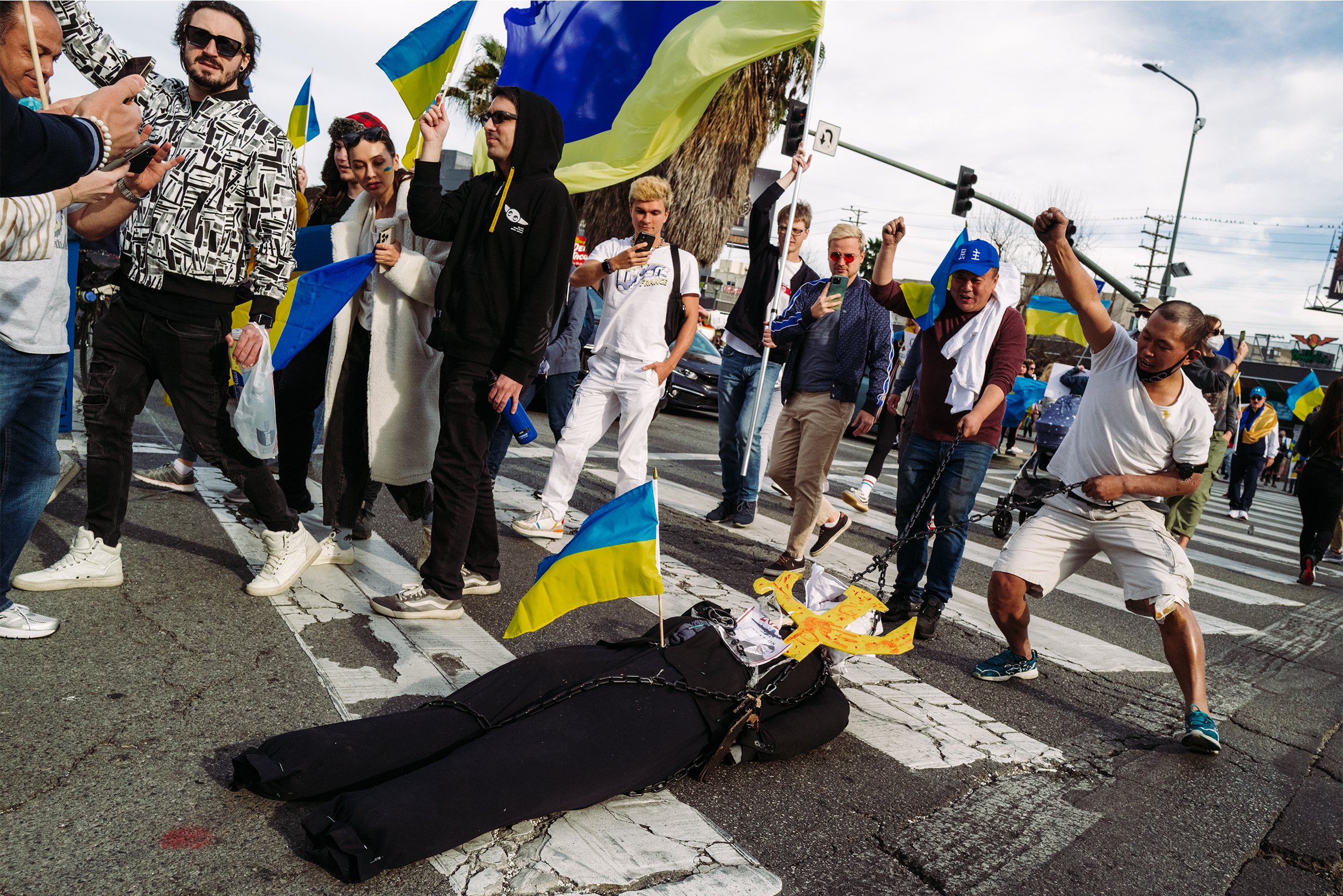  Demonstrators drag a doll representing Russian president Vladimir Putin across Santa Monica Blvd. at the Stand with Ukraine Los Angeles rally against the start of the war in Ukraine in Los Angeles, Calif. on Feb. 26, 2022. The rally took place outsi