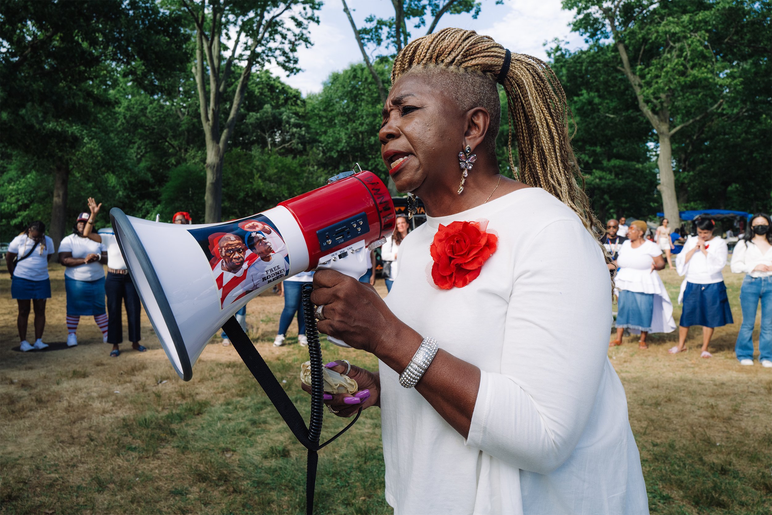  Pastor Sharon Cornelius leads a prayer before performing artists take the stage at the 2022 Gospel Fest in Franklin Park in Boston, Mass. on August 7, 2022. 