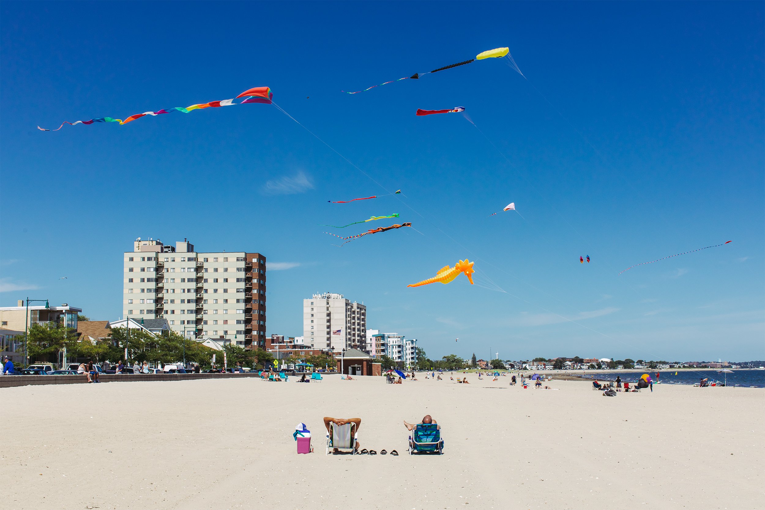  Two men enjoy the end of summer as Kites fly over Revere Beach in Revere, Mass. on September 3, 2022. 