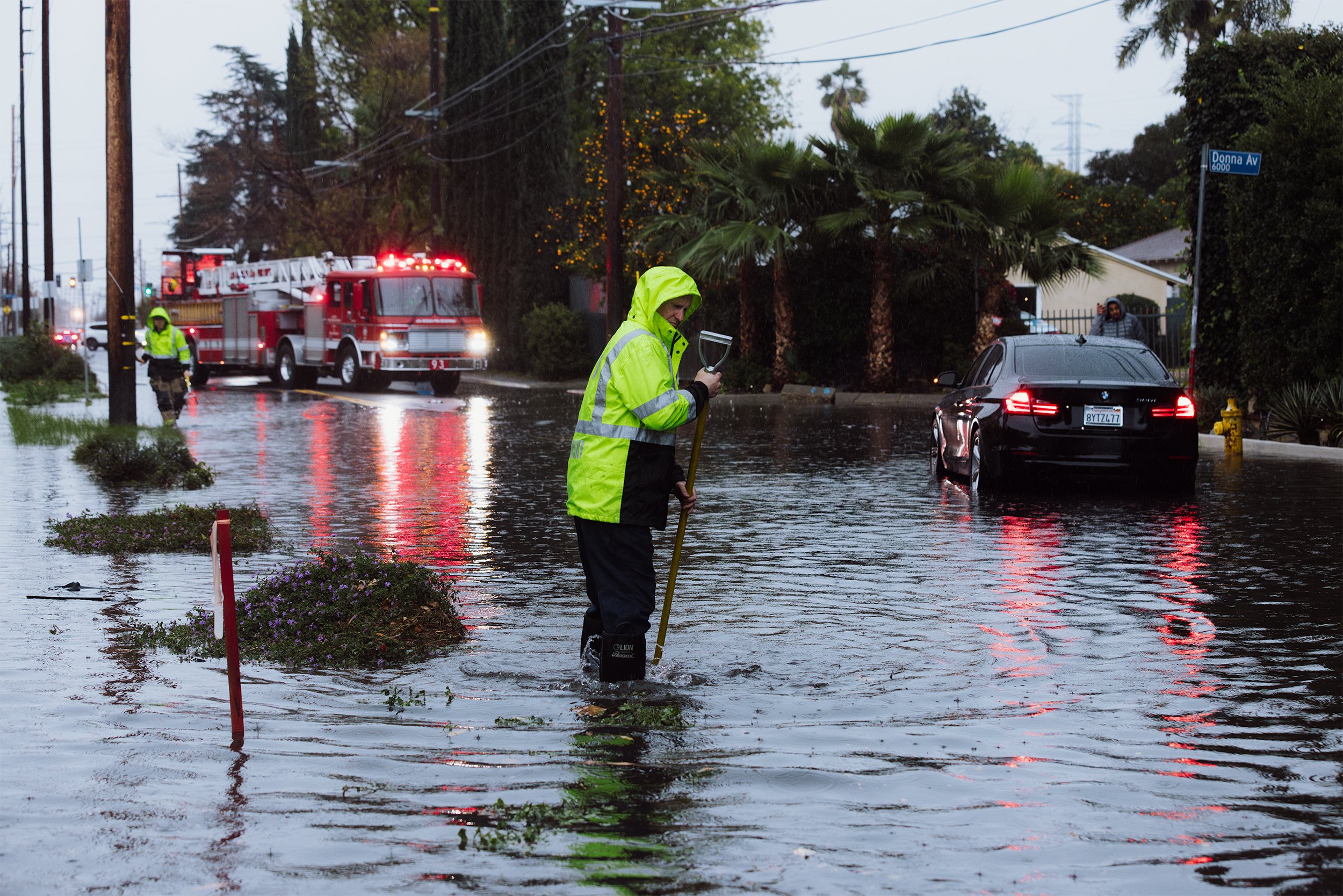  Firemen work on flooded area in Tarzana, in the San Fernando Valley region of Los Angeles, California, February 1. 