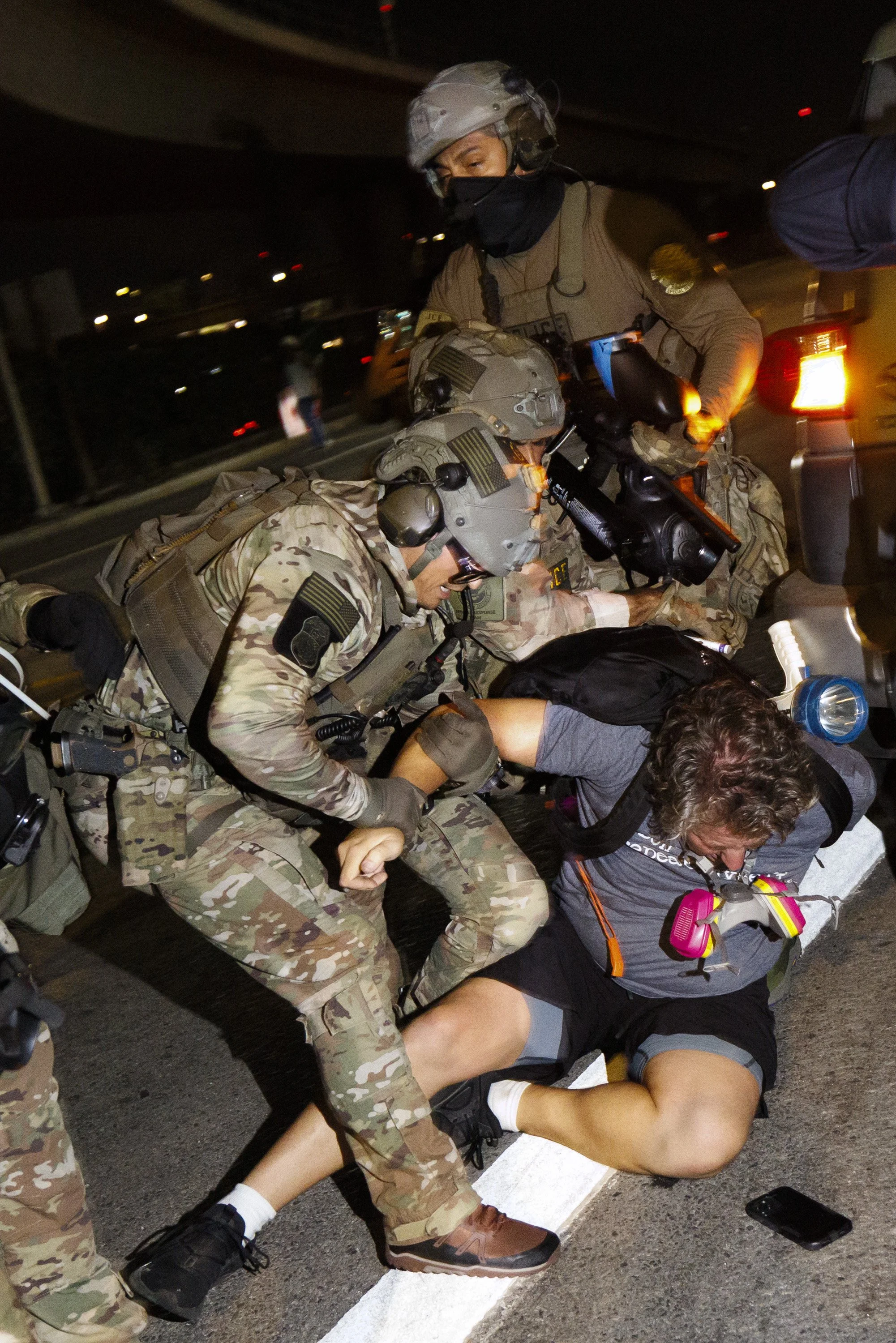   ICE Police detain Joseph Harmon outside the Edward R. Roybal Federal Building while demonstrators were advocating for immigrant rights on Labor Day, Monday, Sept. 1, 2025 in Los Angeles, Calif. 