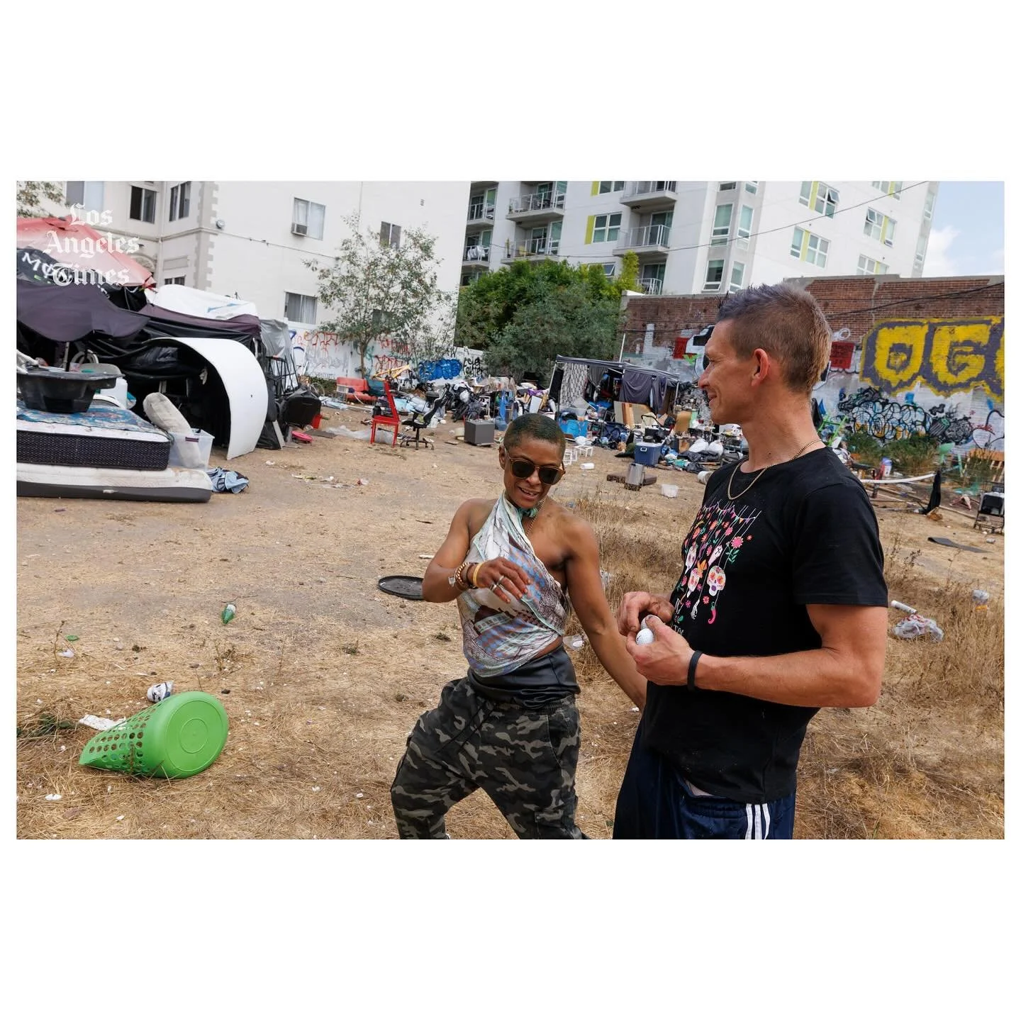 A Koreatown homeless encampment, with pickleball court and garden, is removed following complaints

@latimes 

Candace Bunzy-Marquez playfully pushes up on Tim Gilbert at a homeless encampment on a closed-off lot on Manhattan Place in Koreatown.

Wor