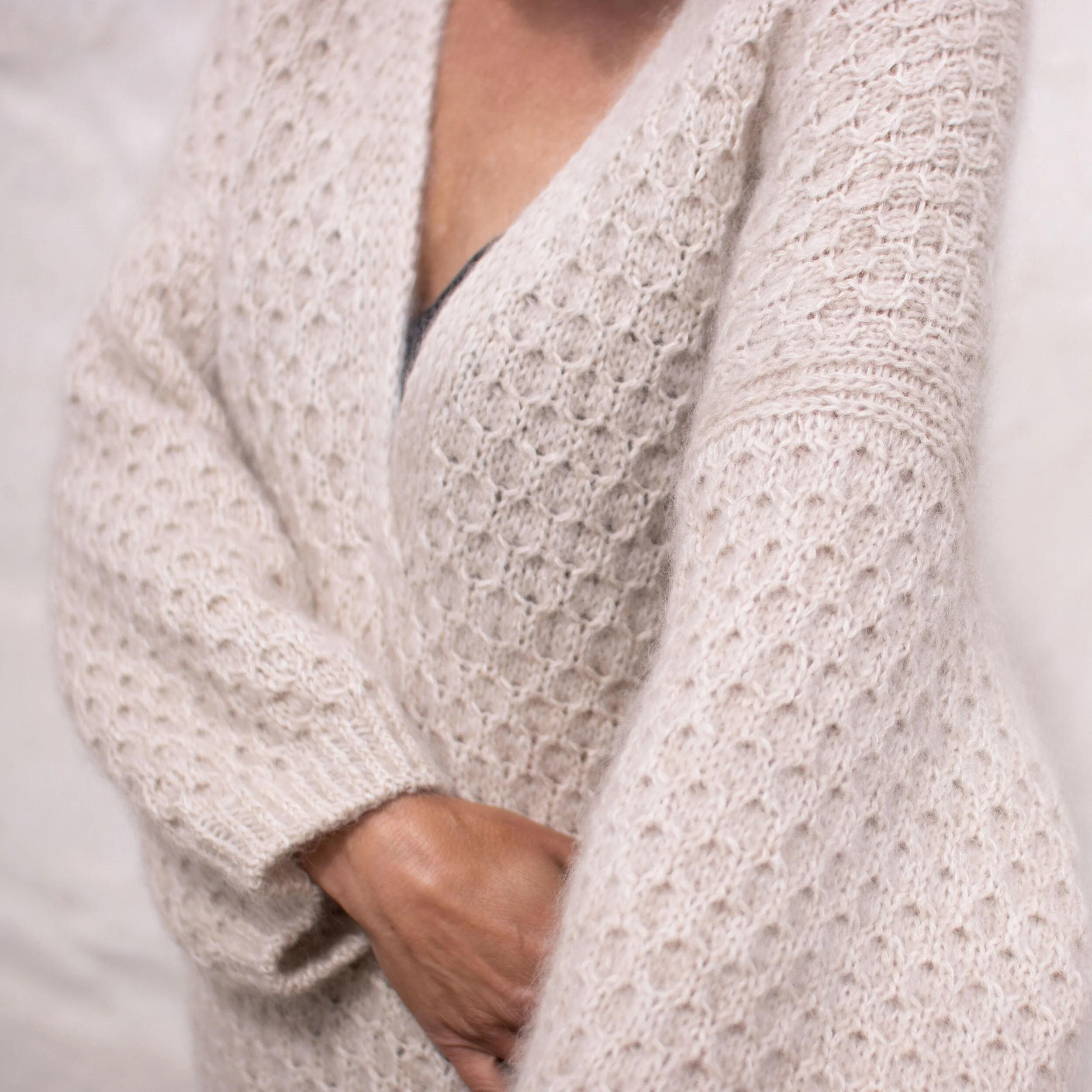 Cardi V-neck, English. The sweater is 