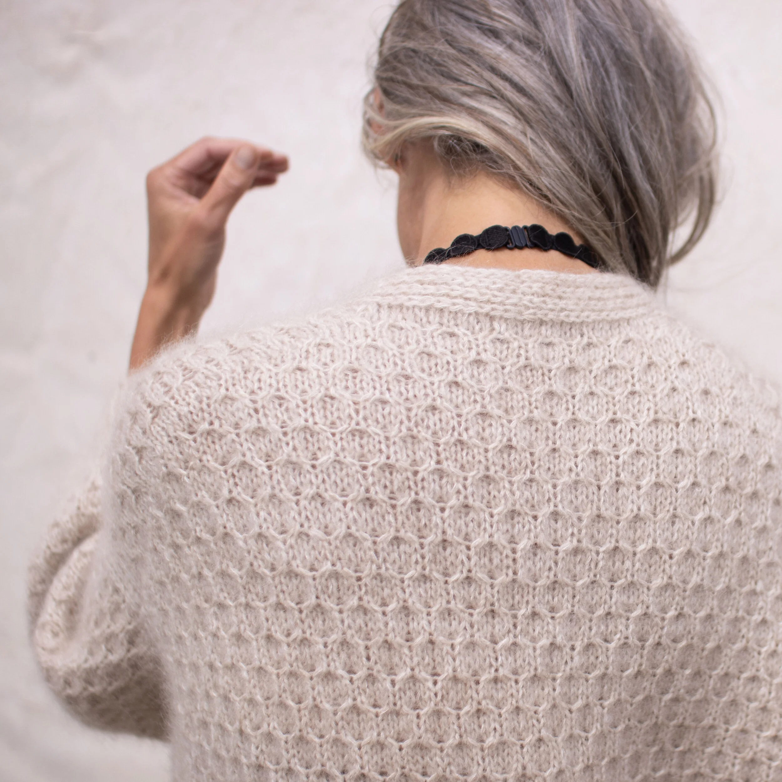 Cardi V-neck, English. The sweater is 