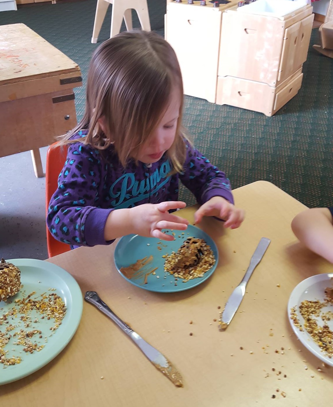 Classroom_Bunny making bird feeder.jpg