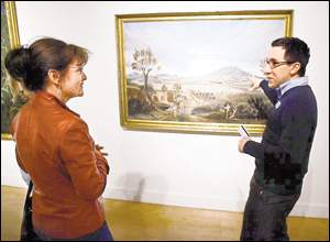 El Paso Museum of Art interim head of education Ben Fyffe and Tracy Trousset talked Tuesday about the painting by 19th-century artist Leon Trousset.PHOTO CREDIT: Victor Calzada - El Paso Times