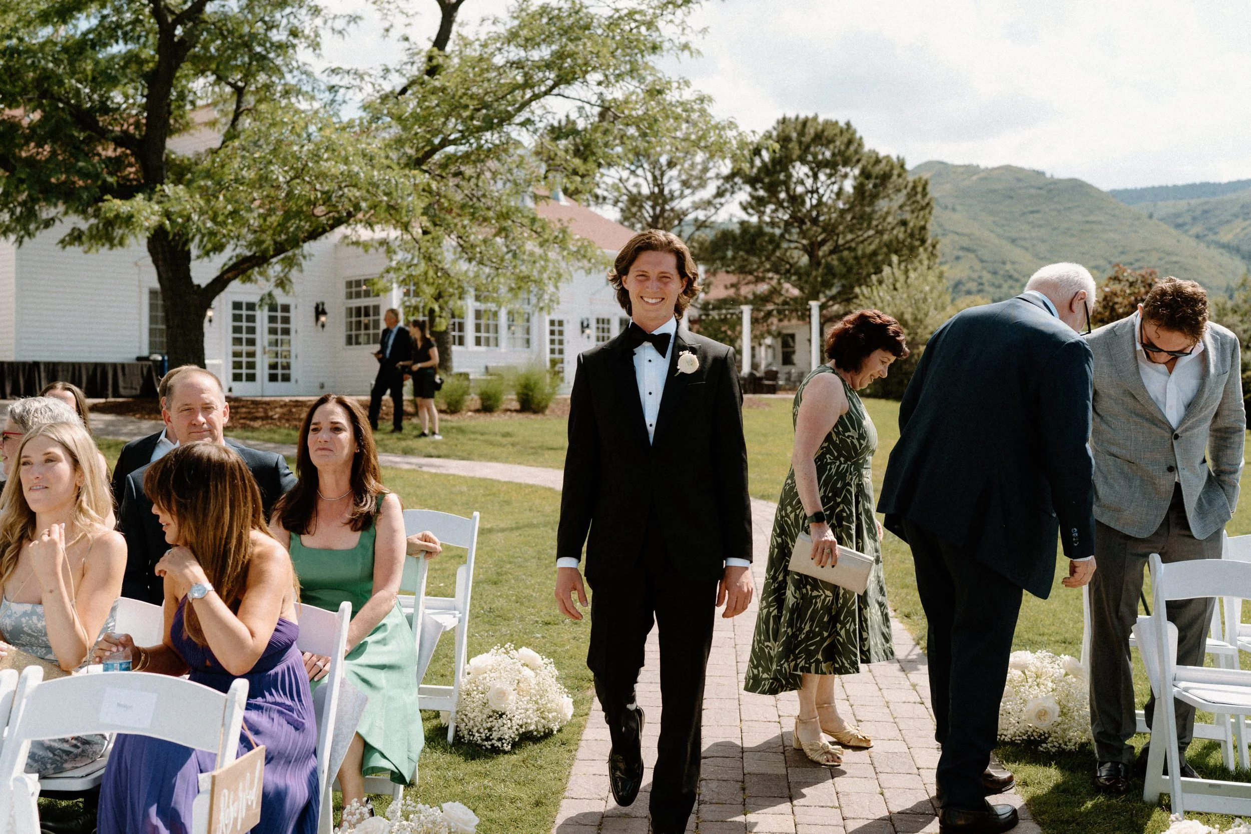 Groom walking down the aisle on wedding day at The Manor House