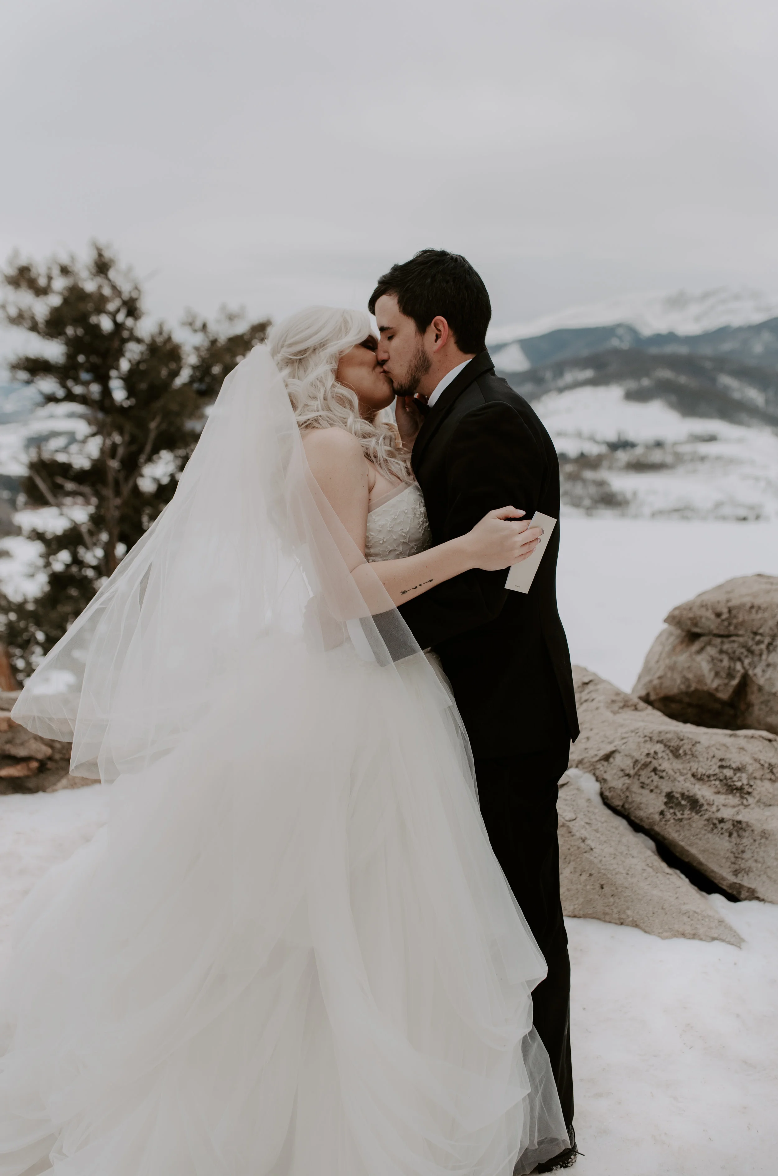  First kiss after the ceremony at this Sapphire Point elopement taken by a destination elopement and wedding photographer based in Colorado. 