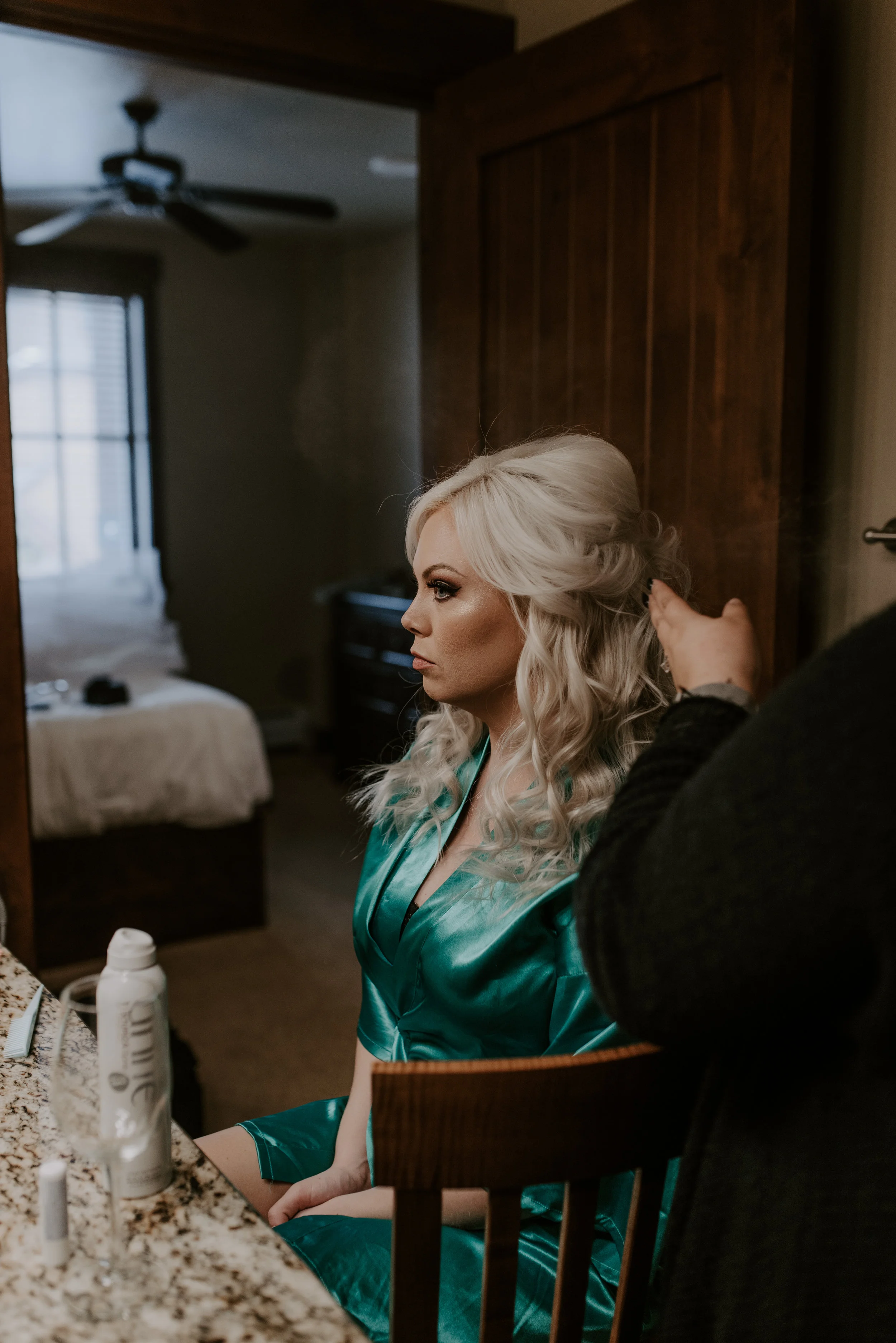  Bride getting ready before her Colorado elopement at Sapphire Point in Breckenridge. Colorado elopement and wedding photographer. 