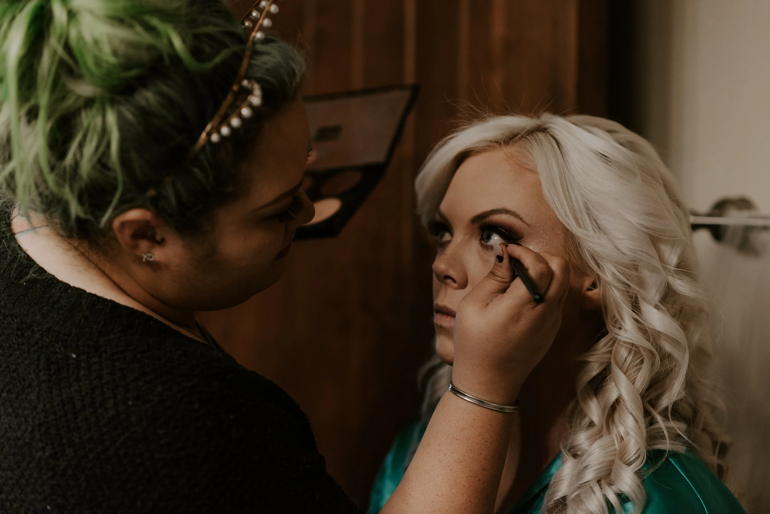  Bridge getting her makeup done before her wedding in Colorado. 