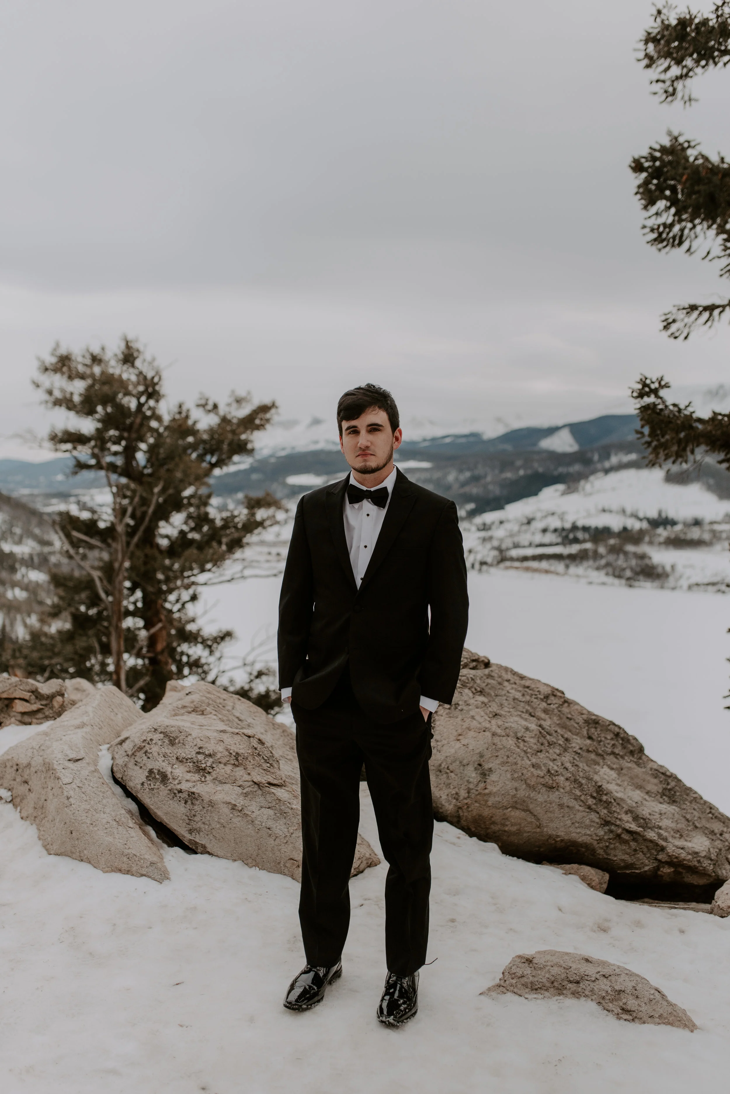  Groom portraits by a Colorado elopement photographer at a Sapphire Point winter elopement. 