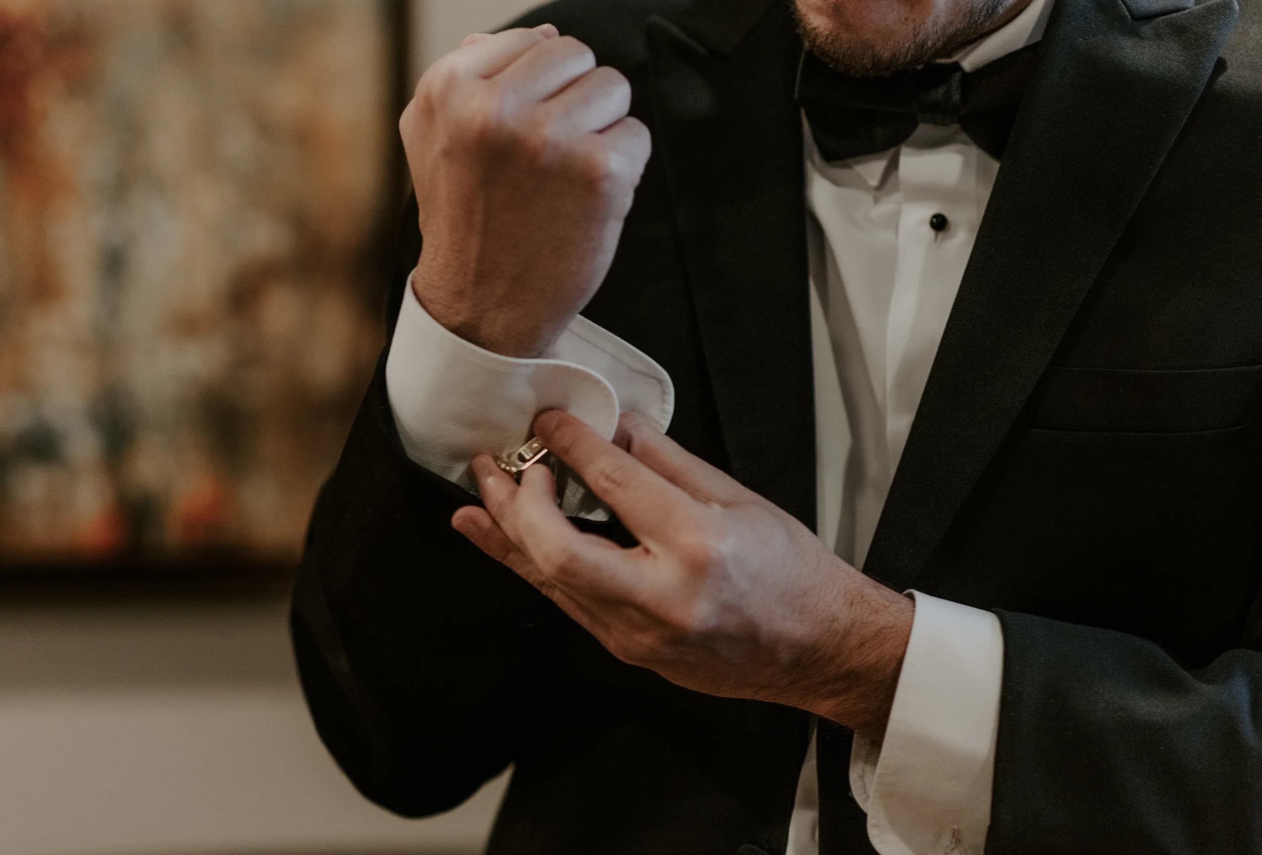  The groom getting ready before a winter elopement at Sapphire Point, taken by a Colorado adventure wedding photographer. 