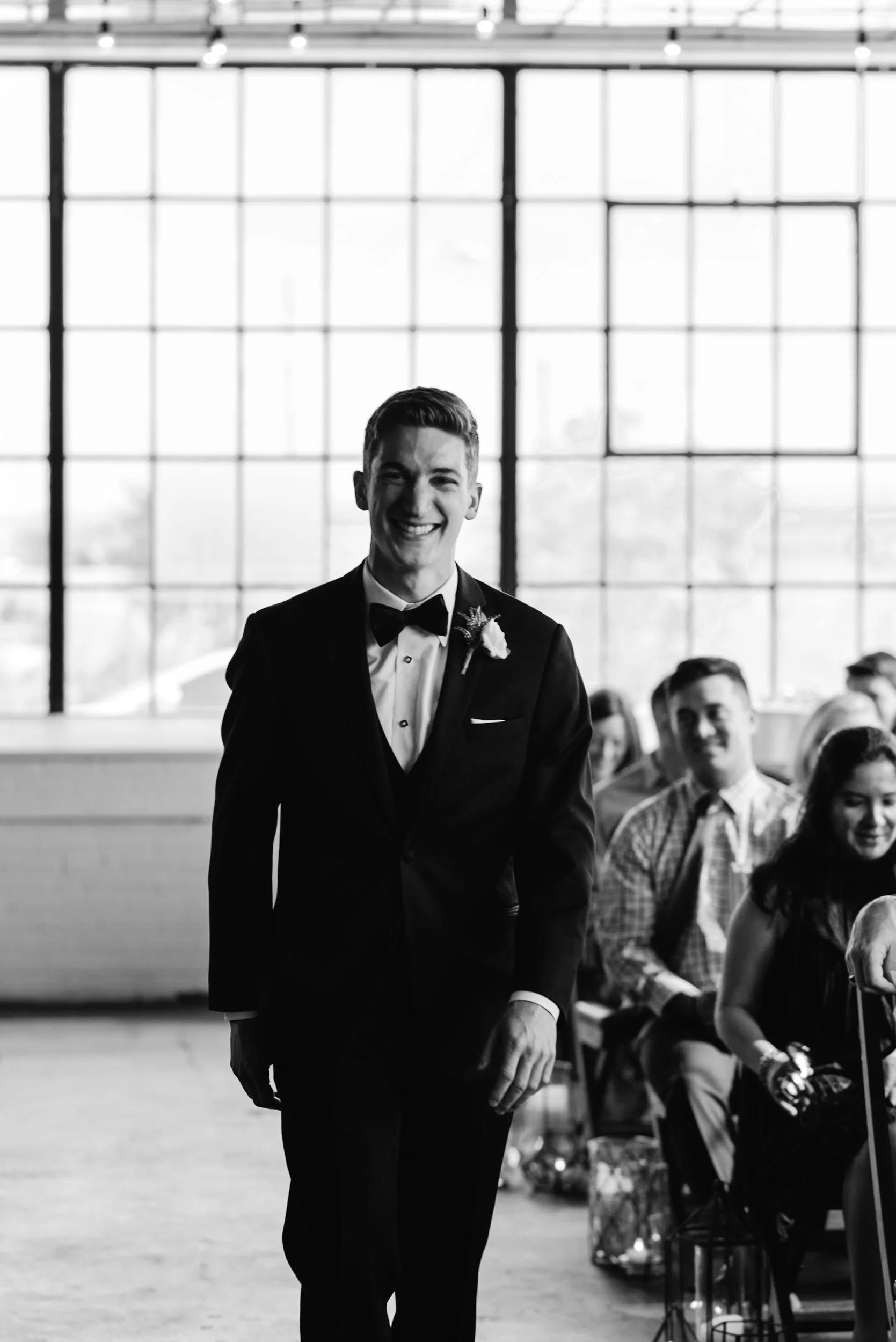  Groom walking down the isle at Moss Denver Wedding. Colorado wedding photographer. 