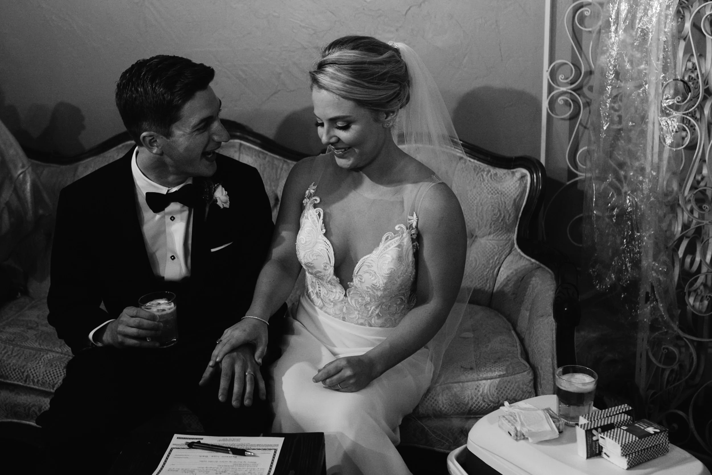  Bride and groom signing marriage certificate at Moss Denver wedding. 