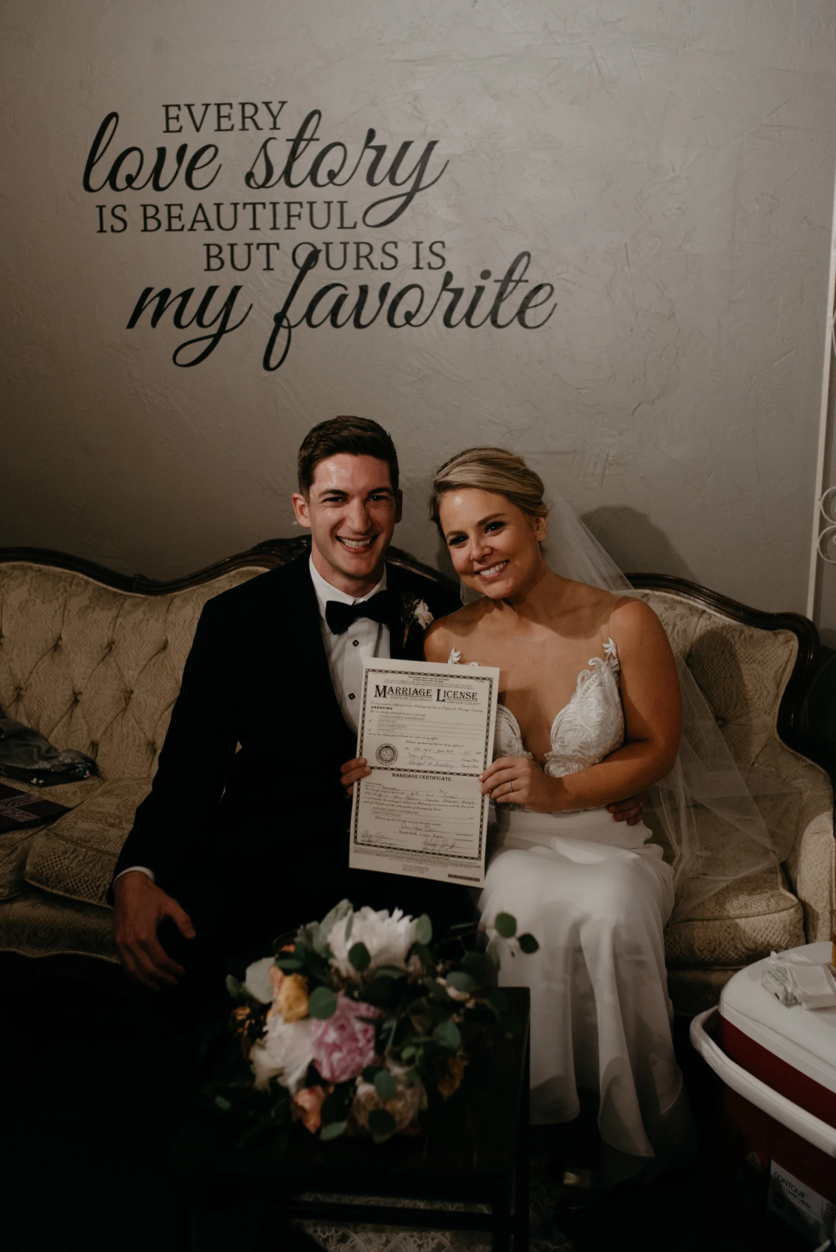  Bride and groom with marriage license. Moss Denver wedding photographer. 