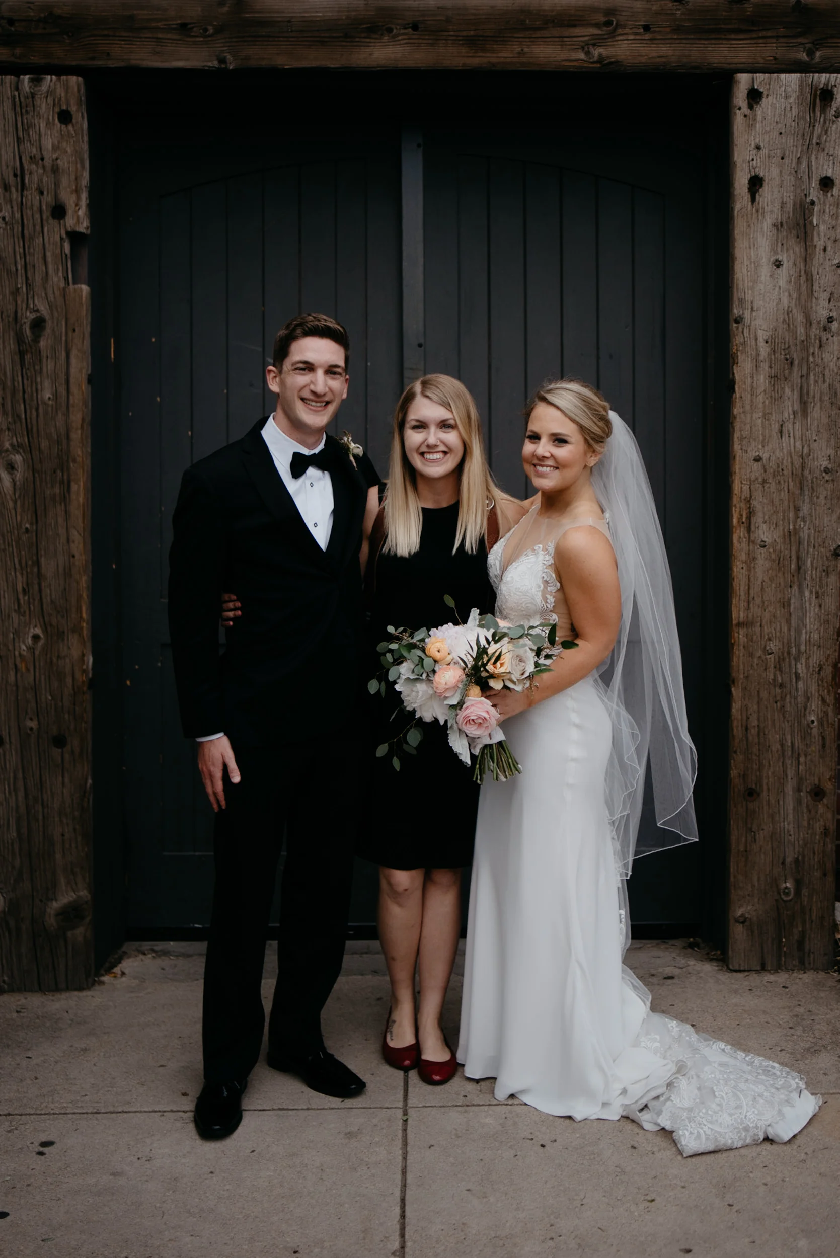  Photographer, Alyssa Reinhold with bride and groom at wedding at Moss in Downtown Denver. 
