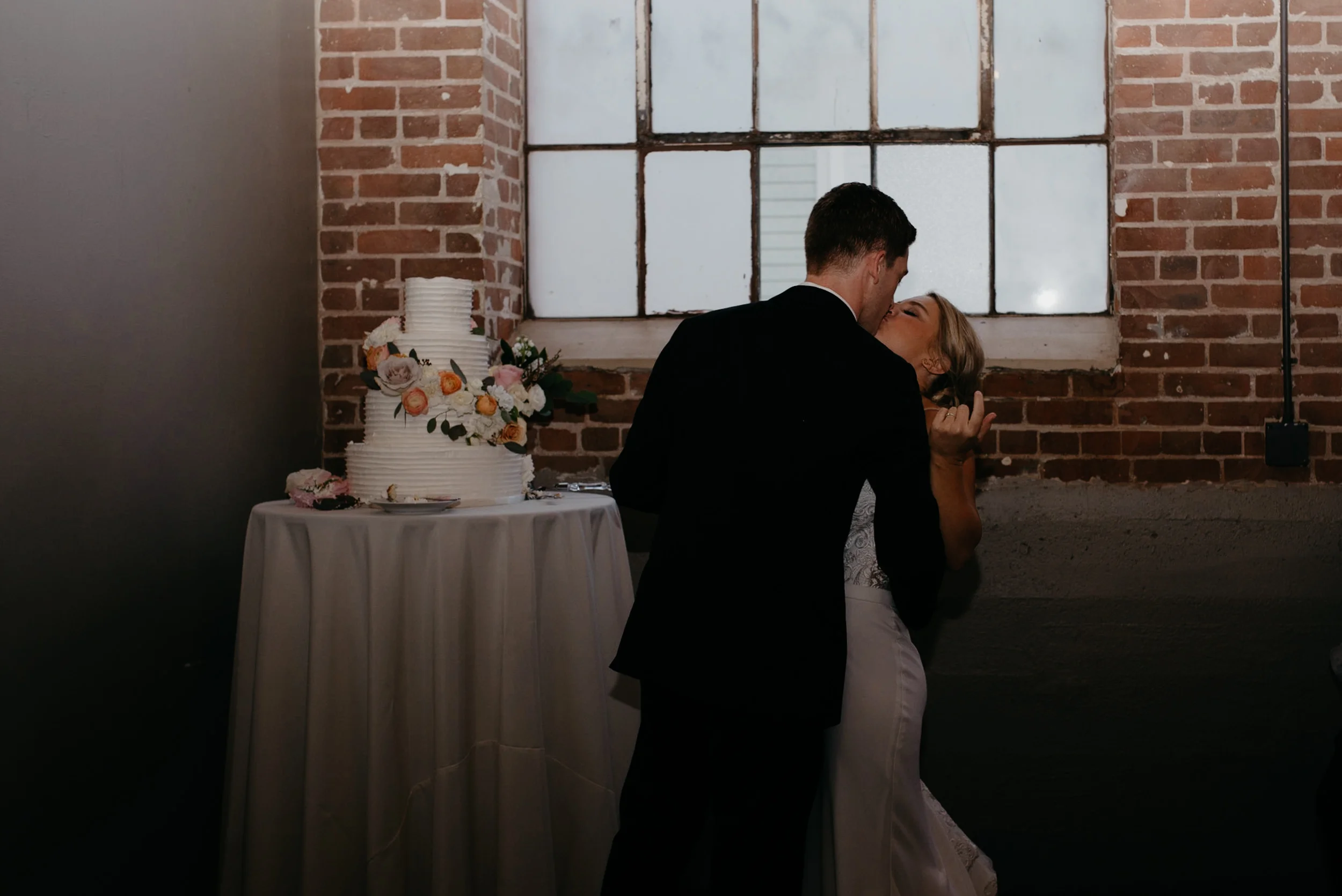  Cake cutting at Moss Denver wedding. Colorado wedding venue. Denver wedding photographer. 