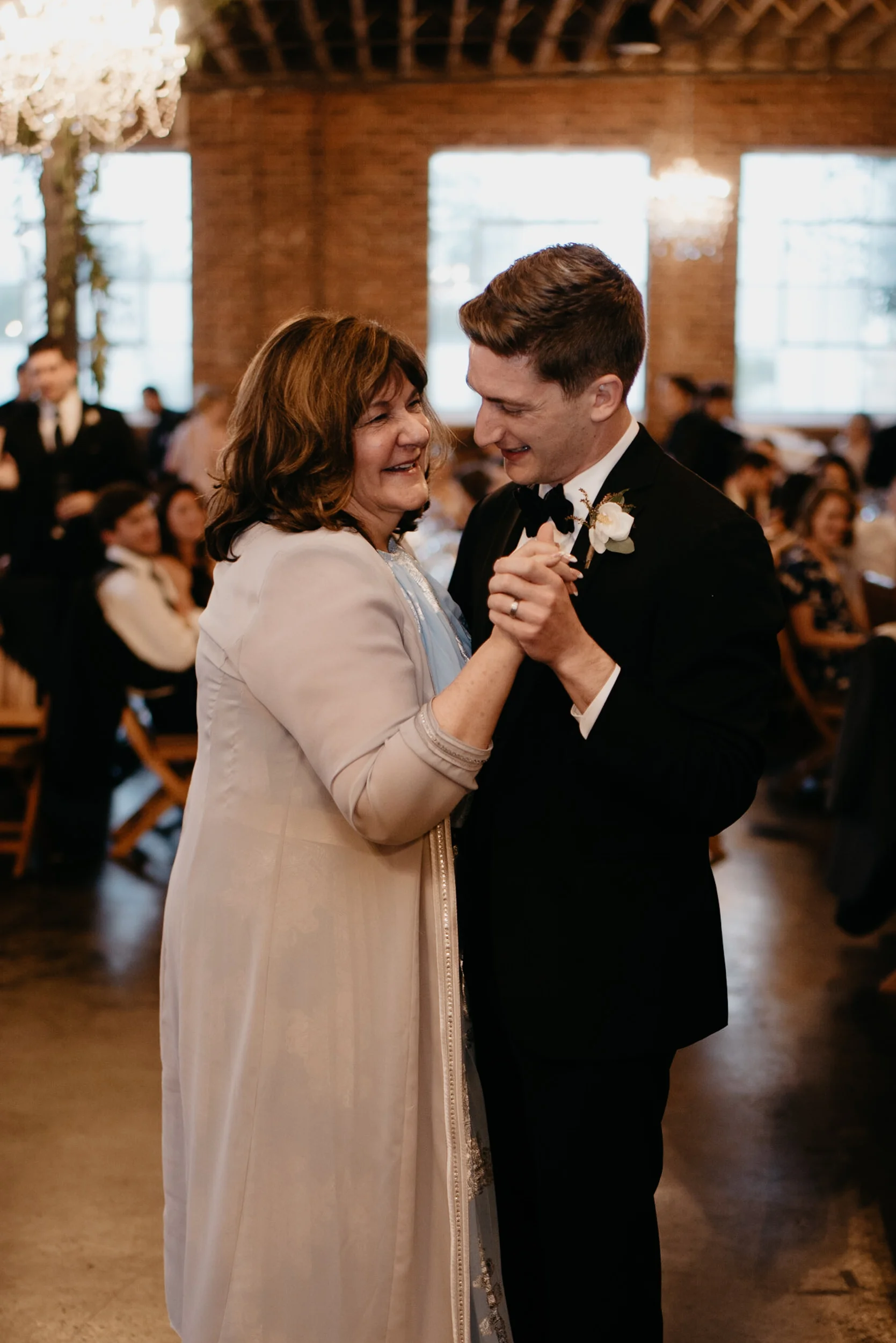 Parent dances at wedding in Denver at Moss. 
