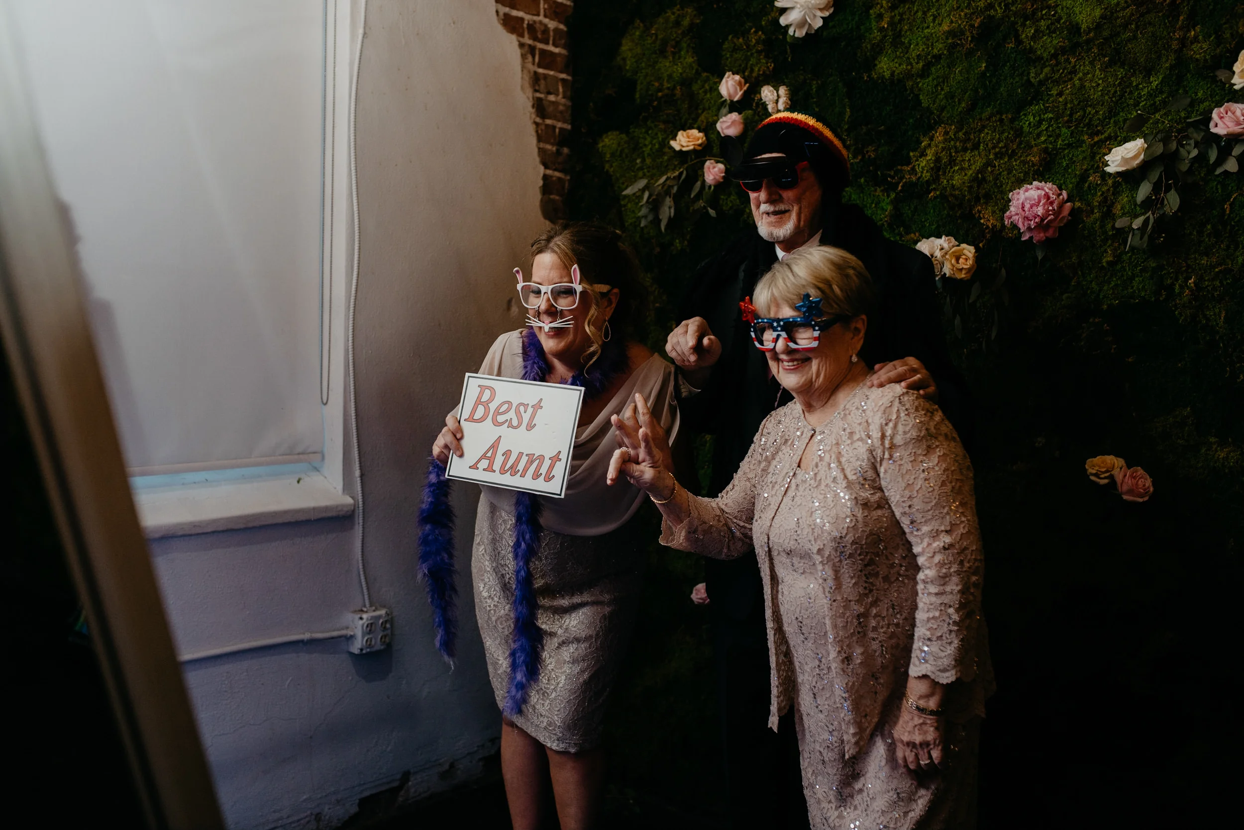  Guests using photobooth at wedding at Moss in Denver. Colorado wedding photographer. 
