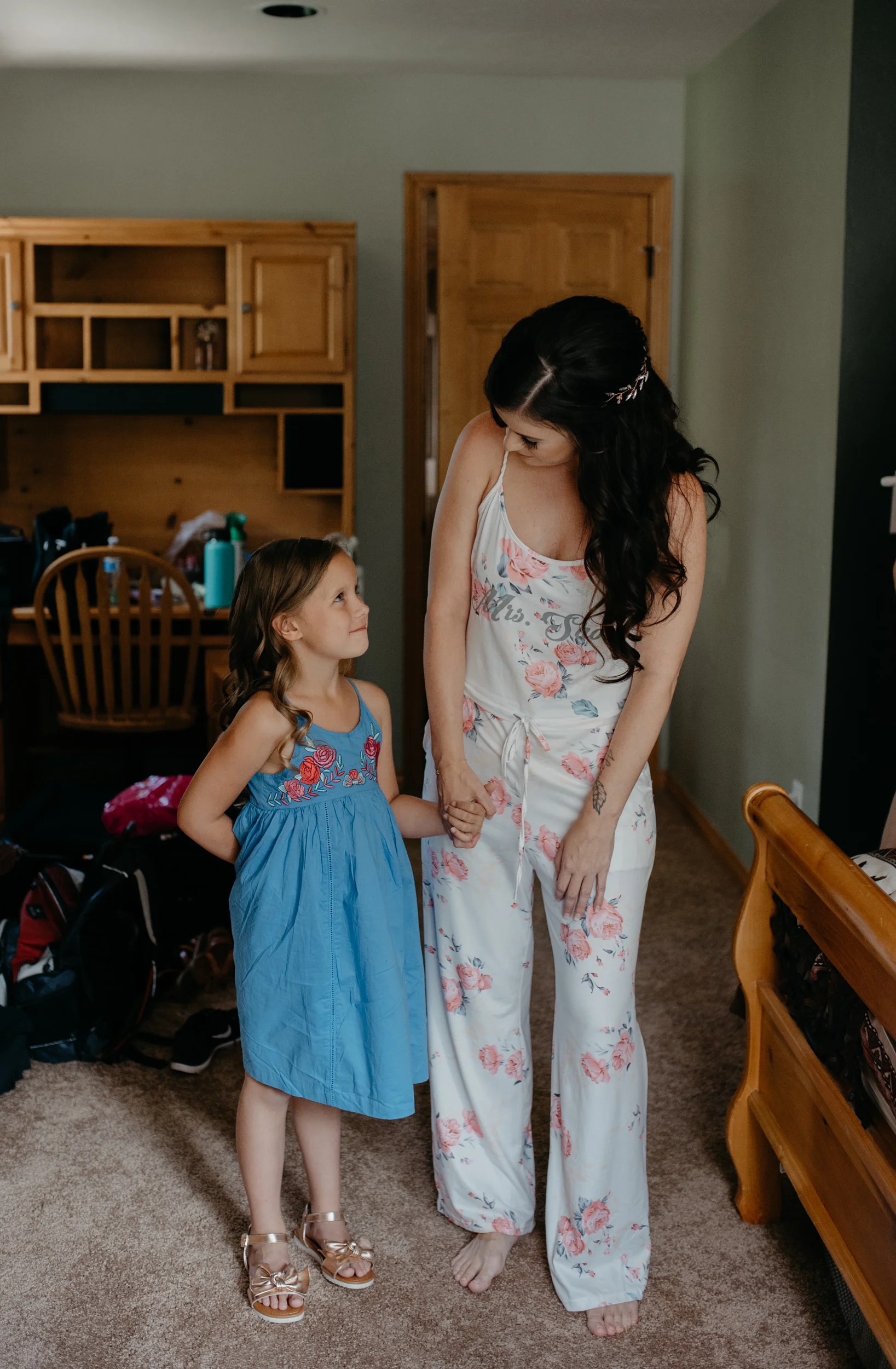  Bride and flower girl getting ready. Wedding at Sapphire Point. Colorado wedding photographer. 