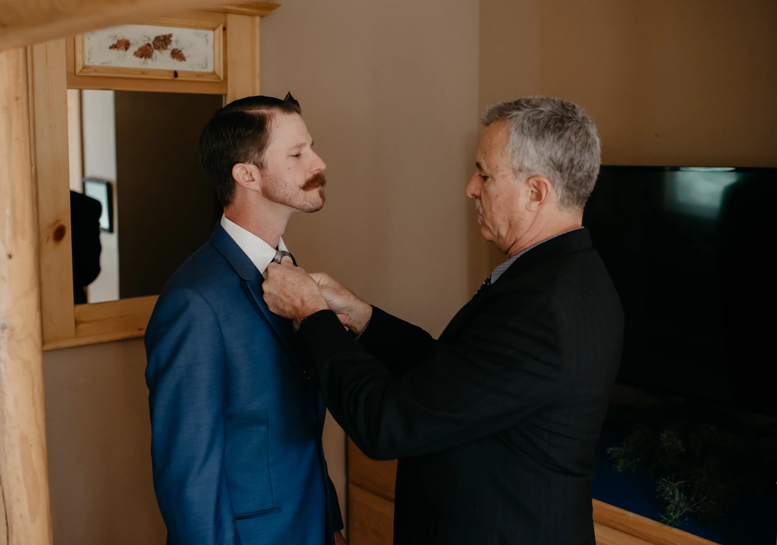  Sapphire Point intimate wedding in Colorado. Groom getting ready. Colorado wedding and elopement photographer. 