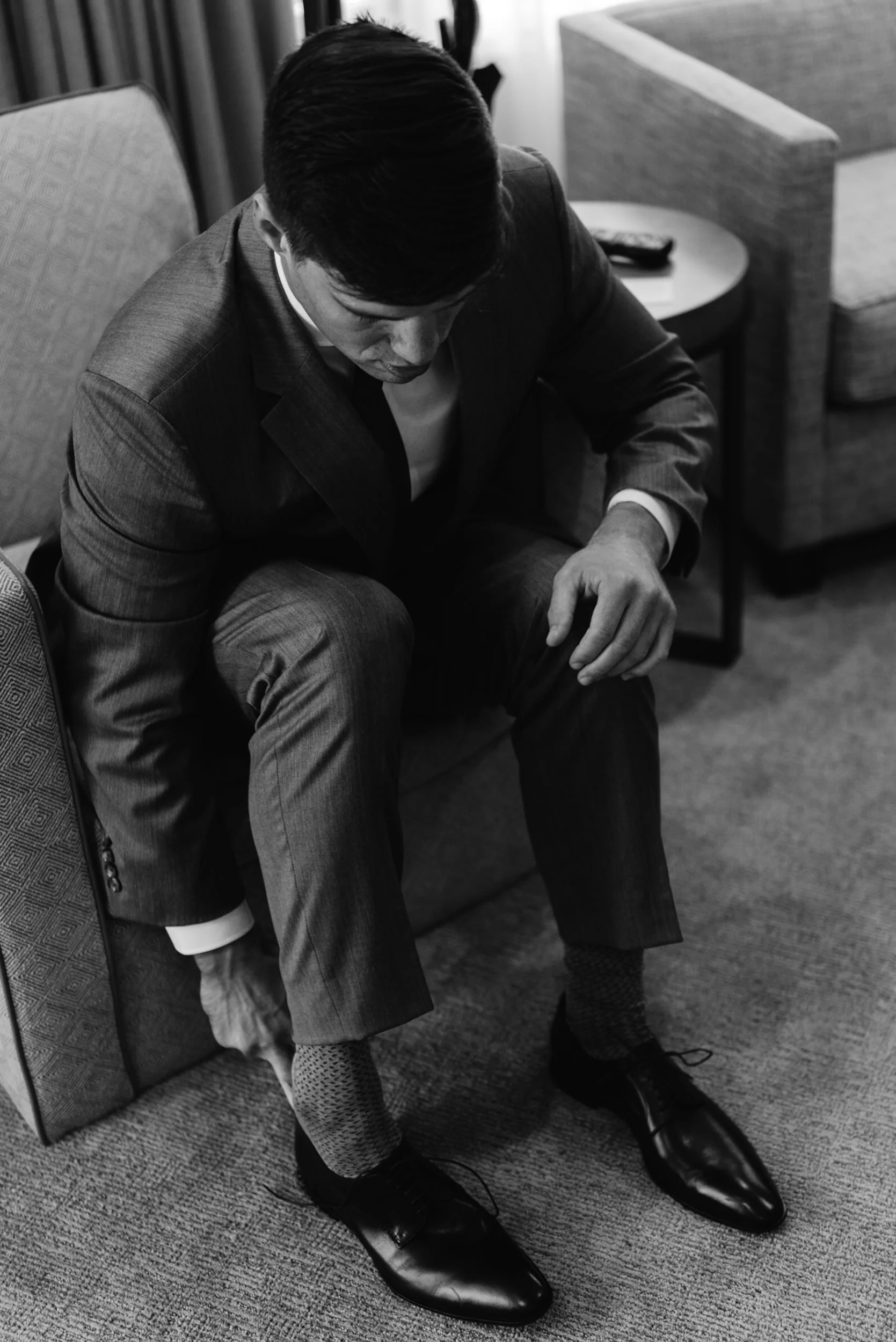  Groom getting dressed. Aspen, Colorado wedding photographer. 