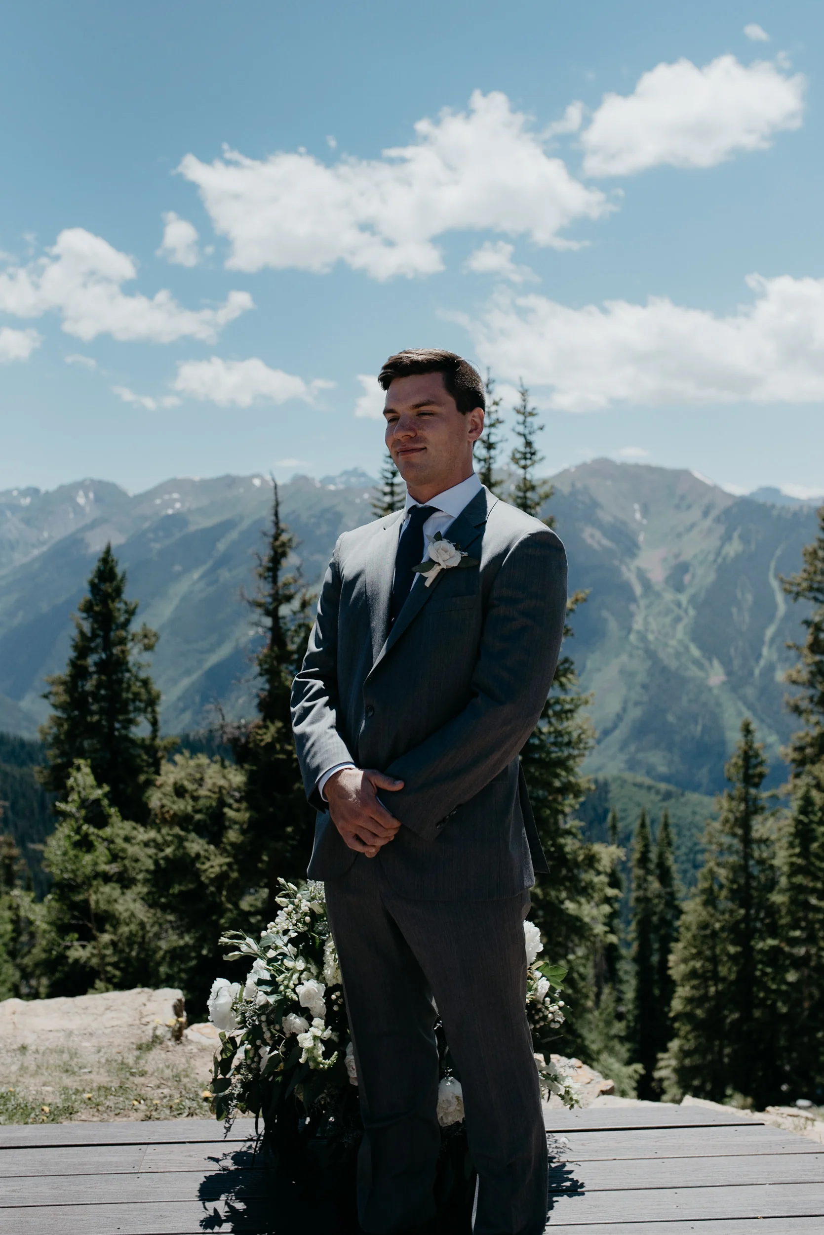  Groom at wedding ceremony in Aspen, Colorado at The Little Nell. 