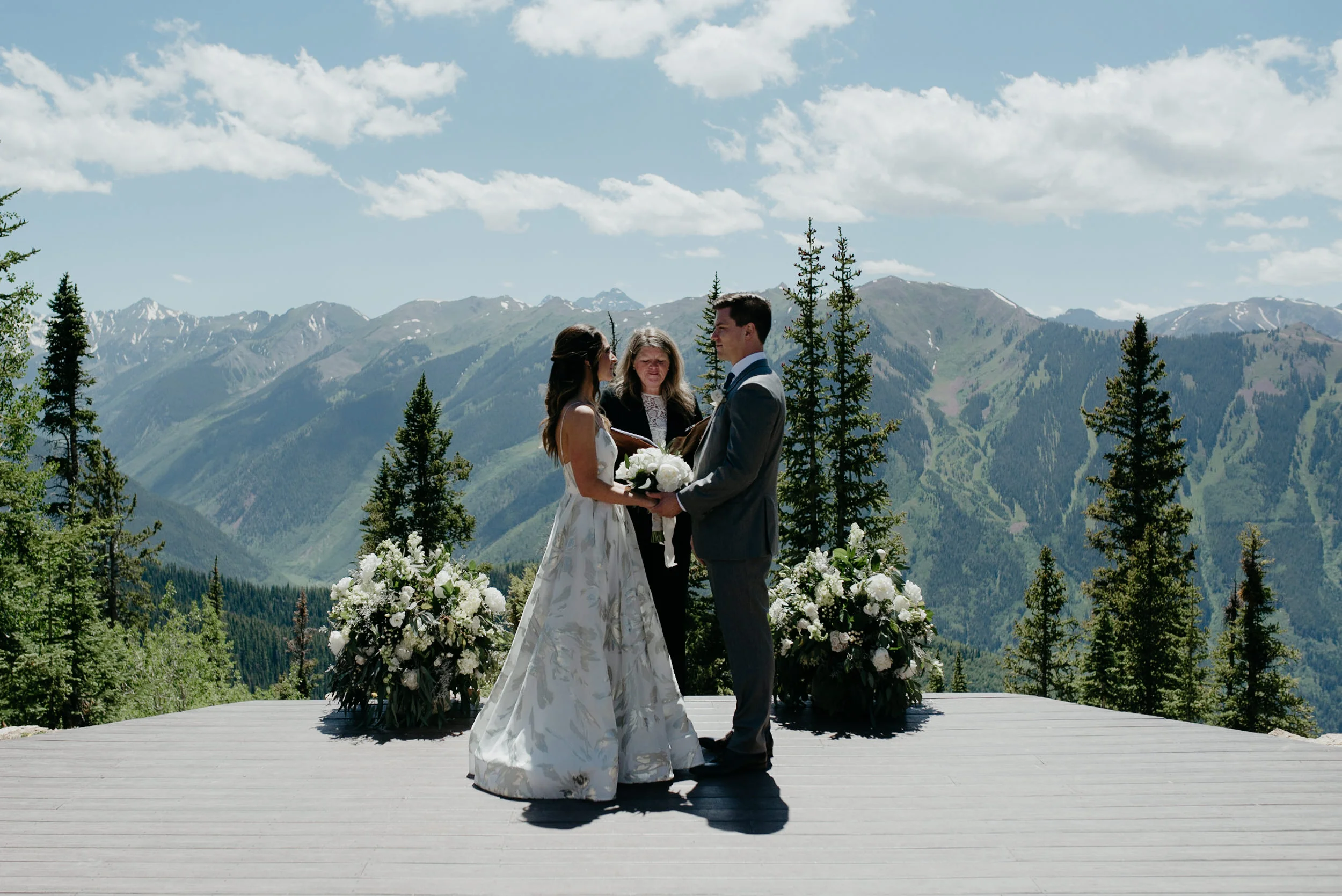  The Little Nell wedding ceremony at Aspen Wedding Deck. Colorado wedding photographer 