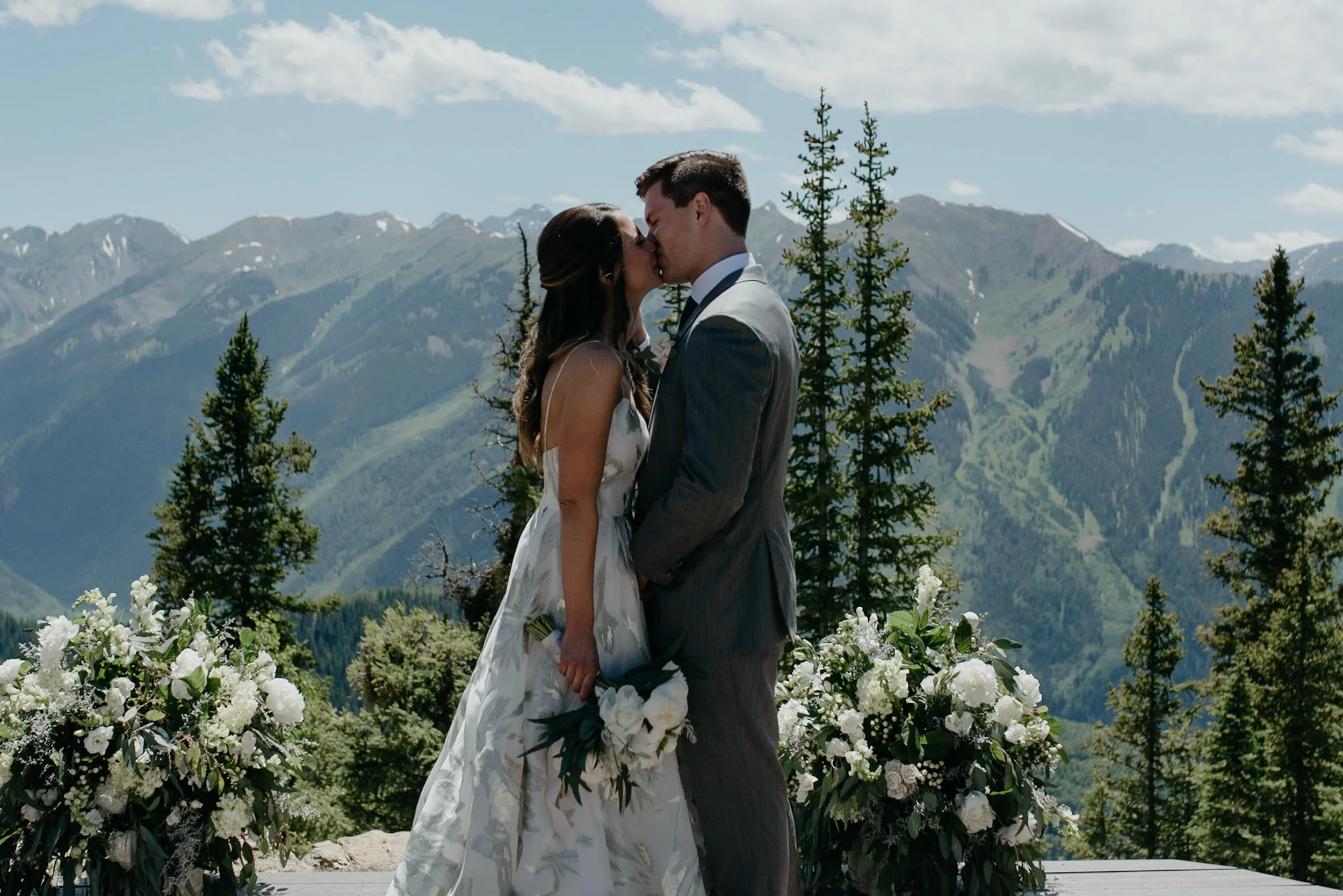  First kiss by Aspen wedding photographer at The Little Nell. 