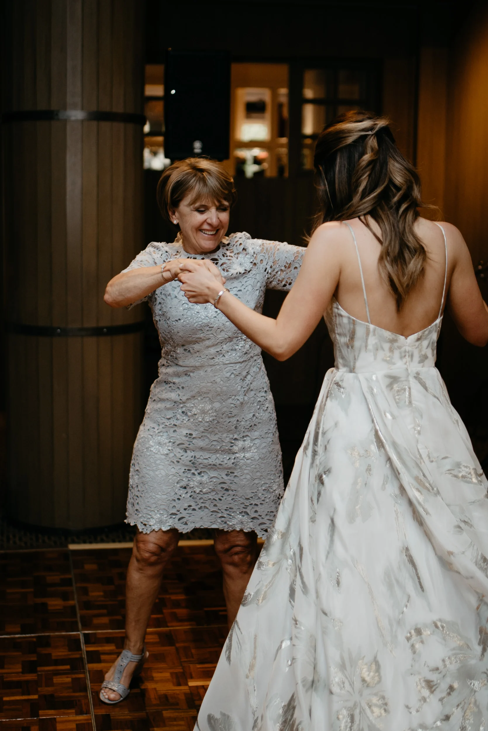  Mom and daughter dancing at The Little Nell taken by an Aspen, Colorado wedding and elopement photographer. 