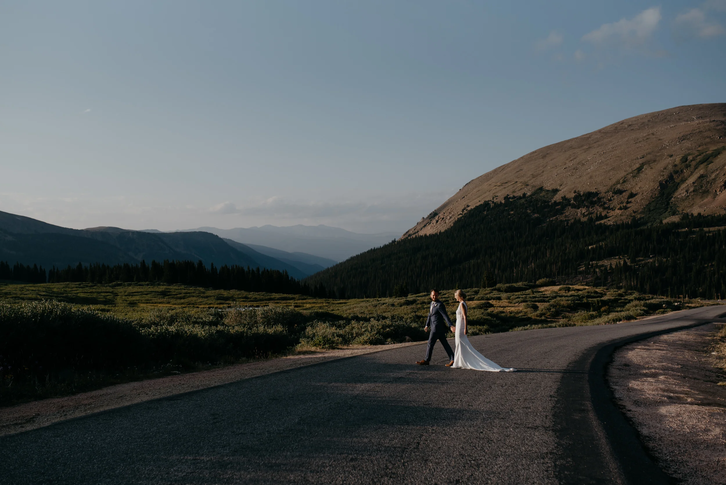  Bride and groom walking in the road 