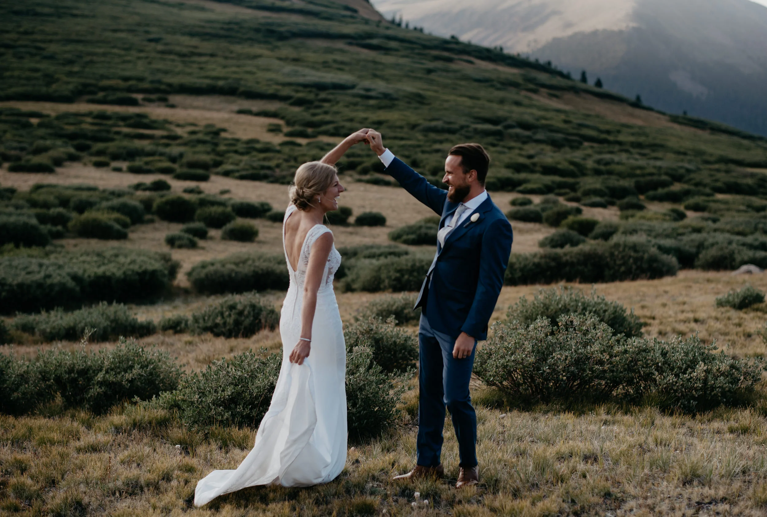  Groom spinning bride at a Georgetown, CO elopement. 