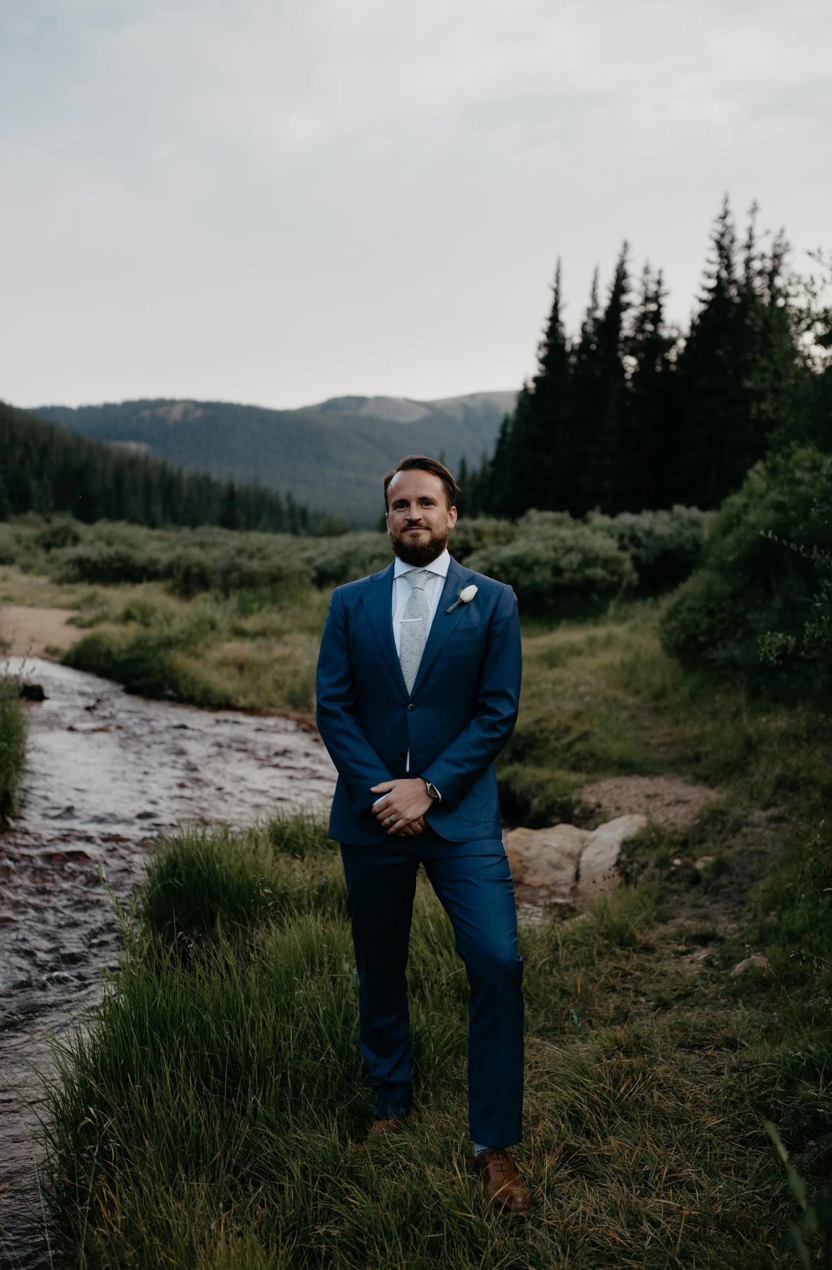  Portrait of groom by Colorado elopement photographer, Alyssa Reinhold. 