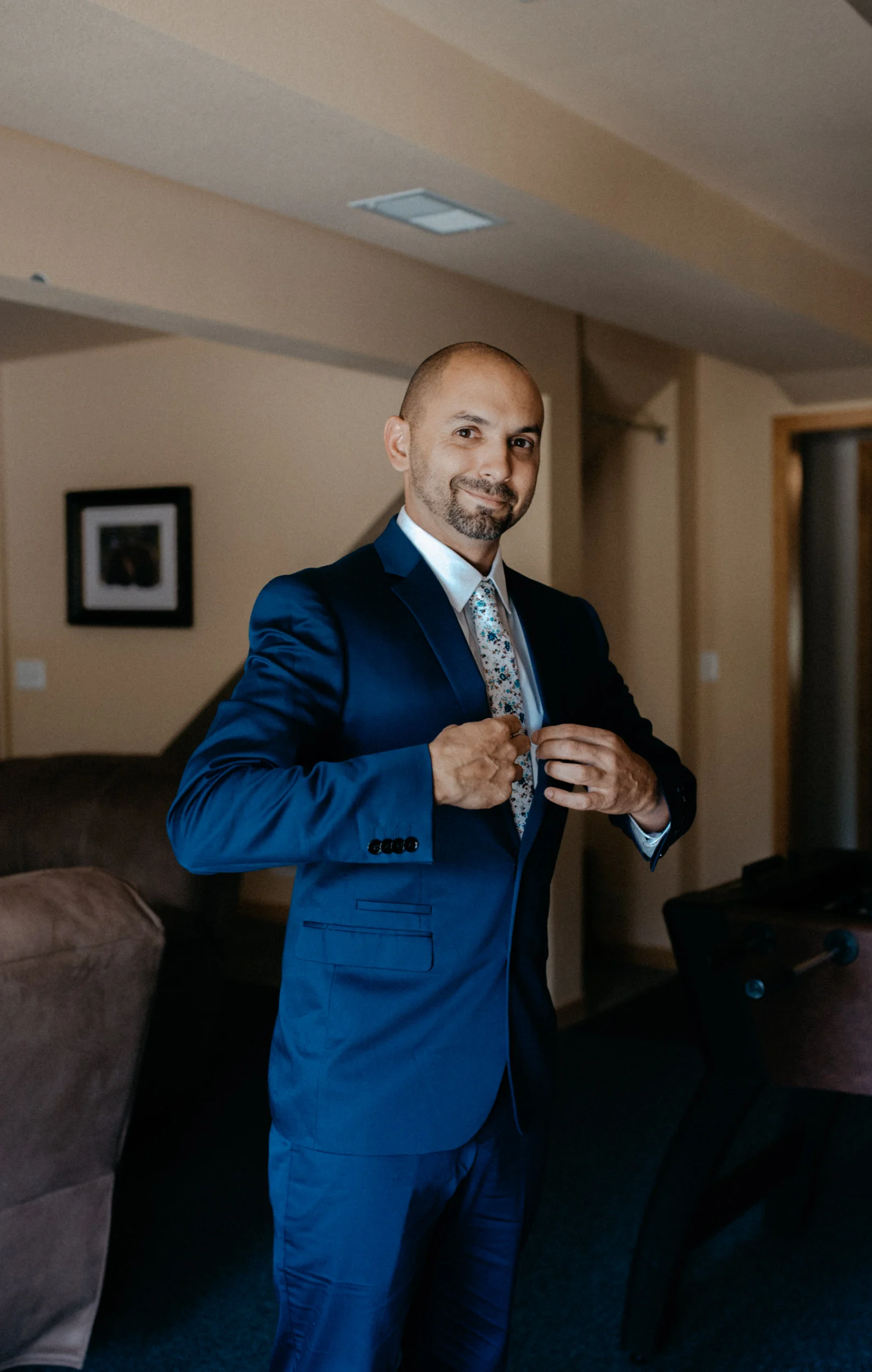  Groom getting ready before Colorado elopement. Rocky Mountain National Park wedding photographer. 