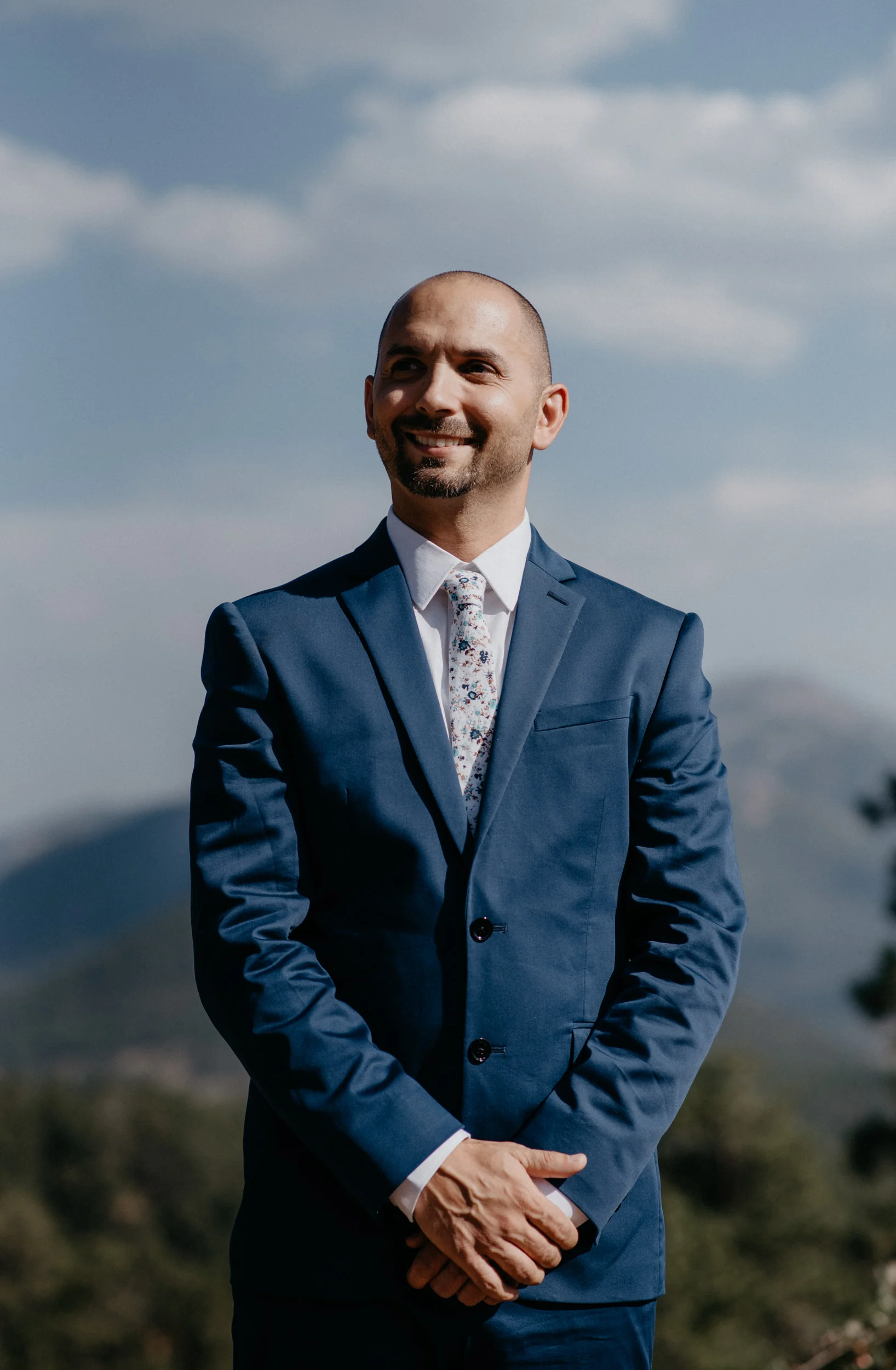  Groom waiting at alter at a Rocky Mountain National Park elopement. 