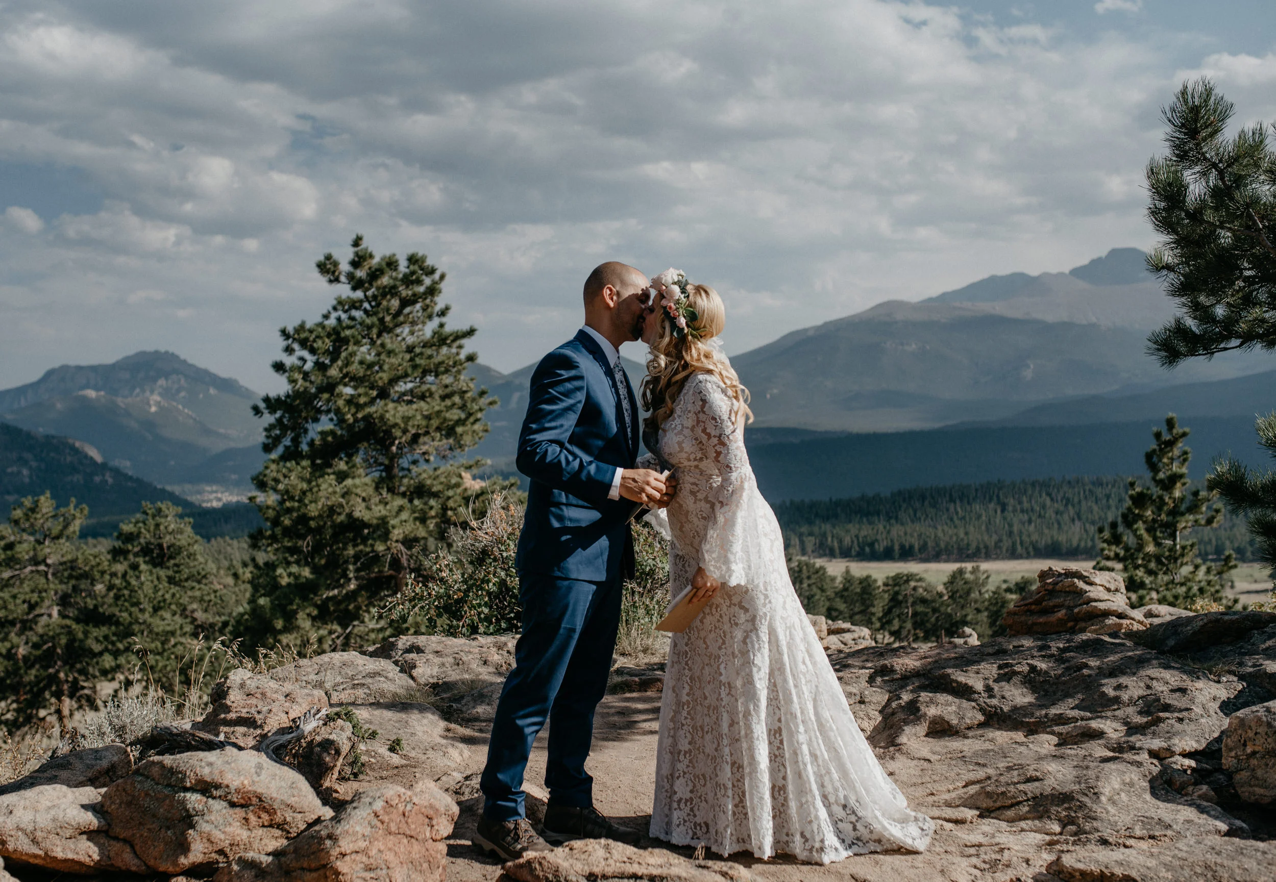  First kiss at Rocky Mountain National Park elopement at 3M curve. Colorado elopement photographer. 