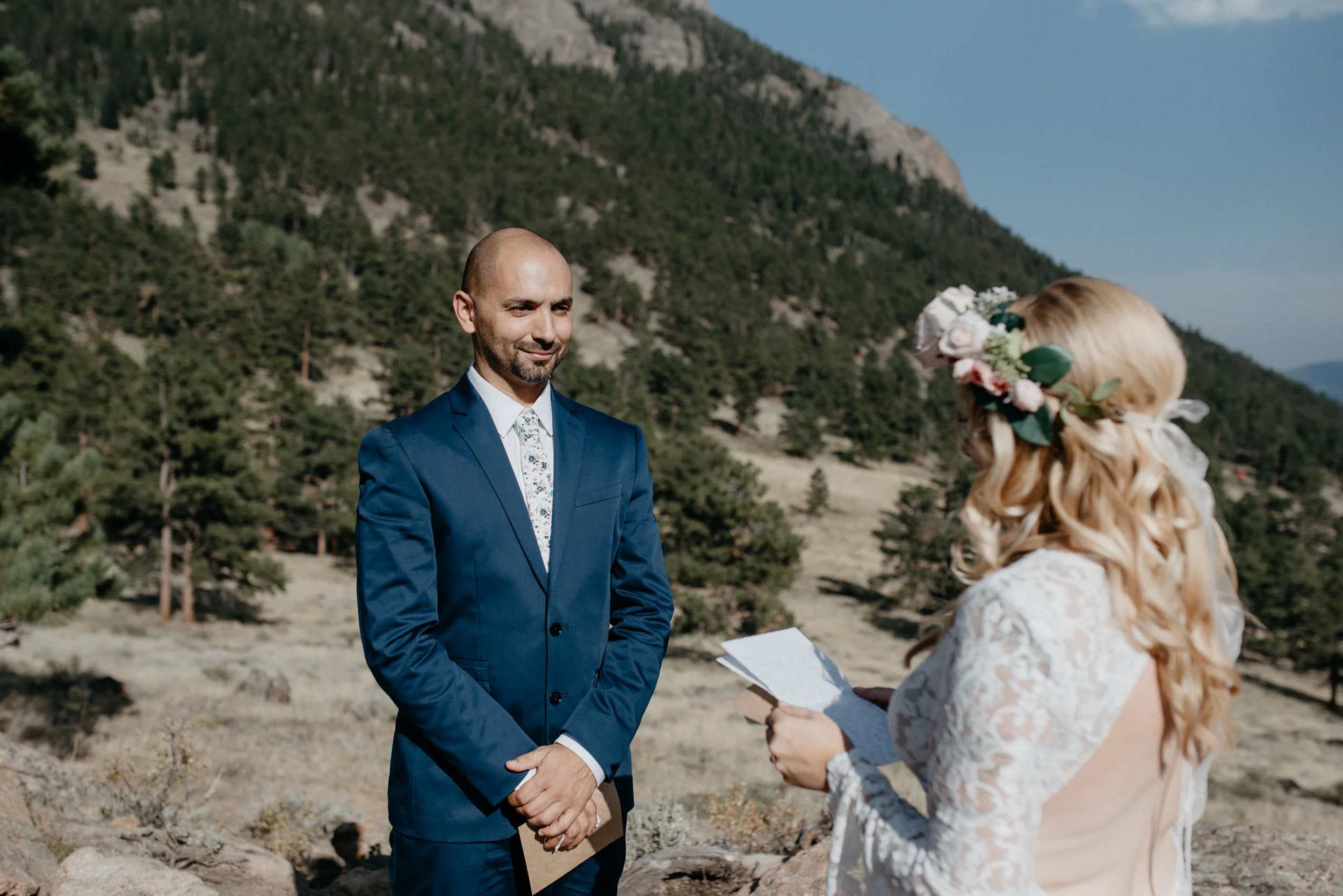  Ceremony at 3M curve in Colorado. Bride and groom exchanging vows. 
