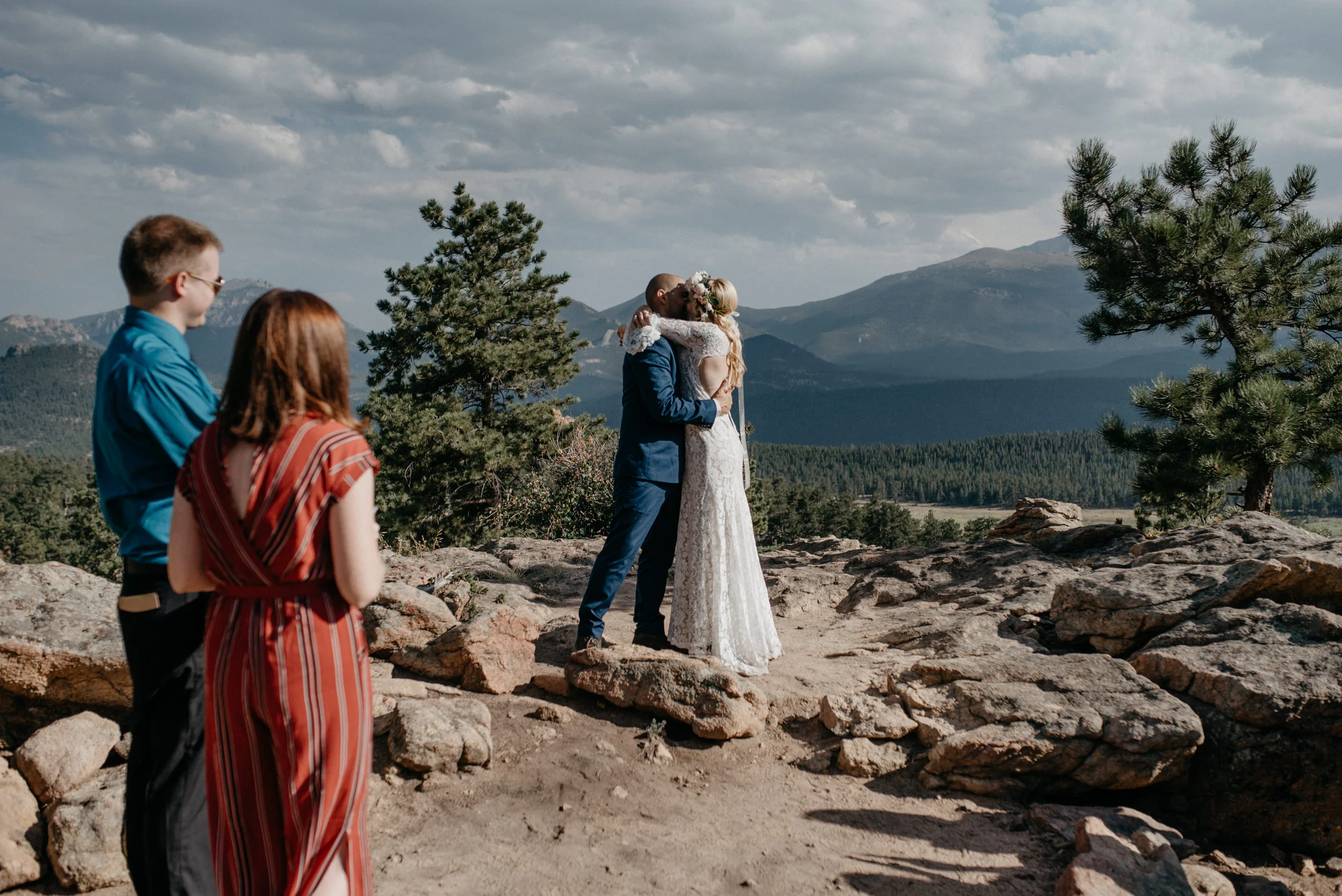  First kiss at intimate ceremony in Rocky Mountain National Park. Colorado elopement at 3M curve 
