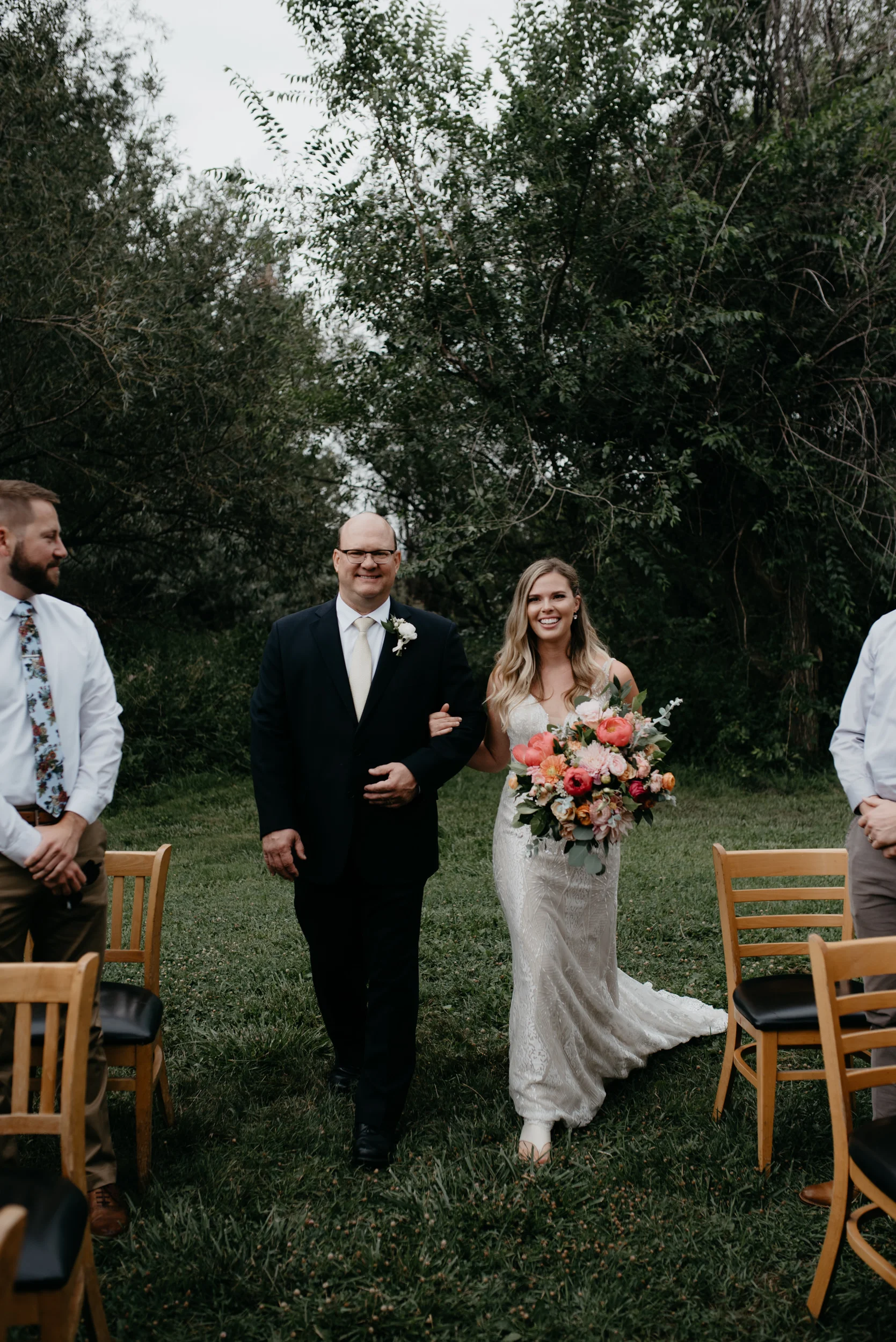  Bride and dad walking down the isle at Boulder, Colorado wedding at Three Leaf Farm. Colorado elopement photographer. 