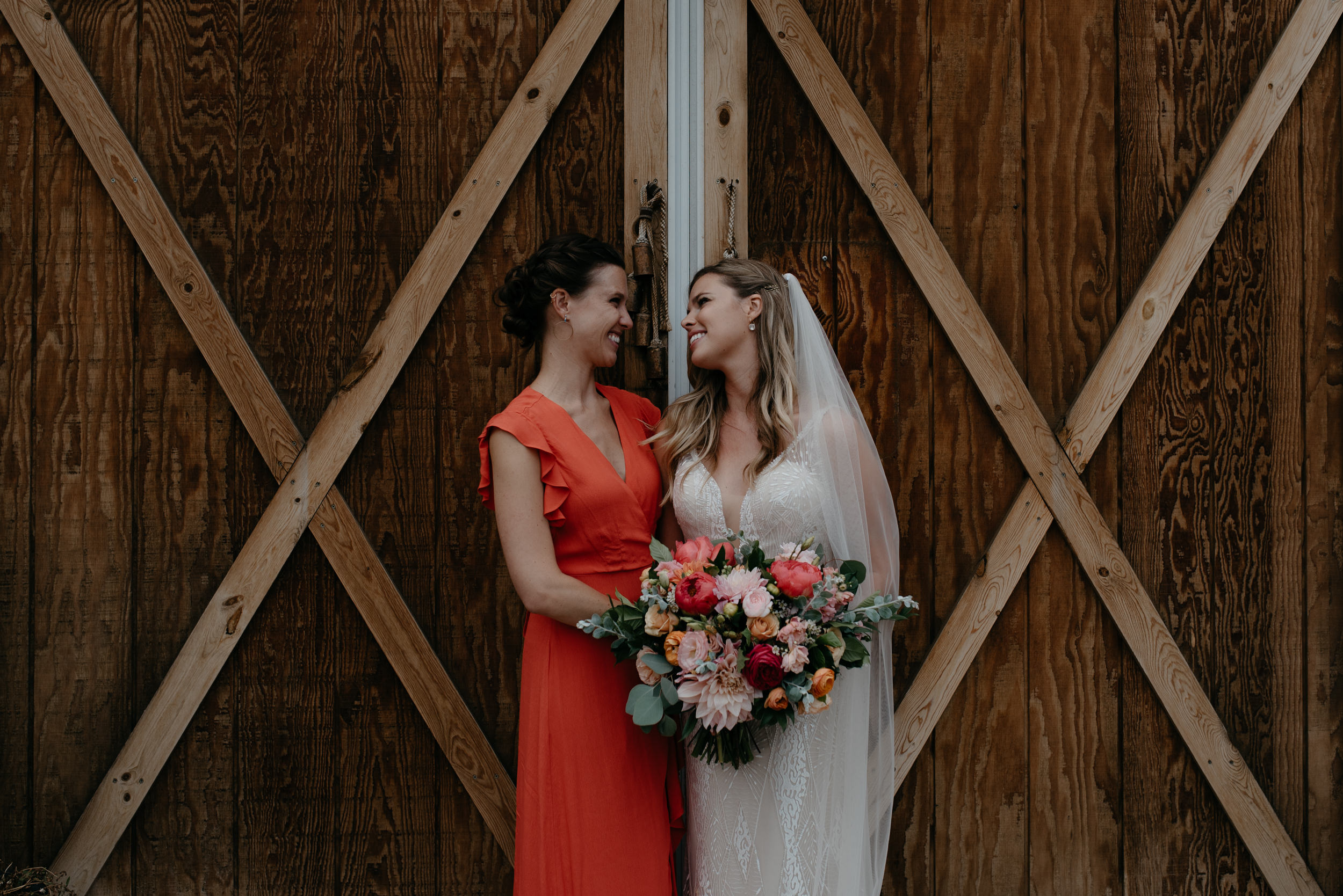  Photos of sisters together at Boulder wedding at Three Leaf Farm. Colorado based wedding and elopement photographer. 