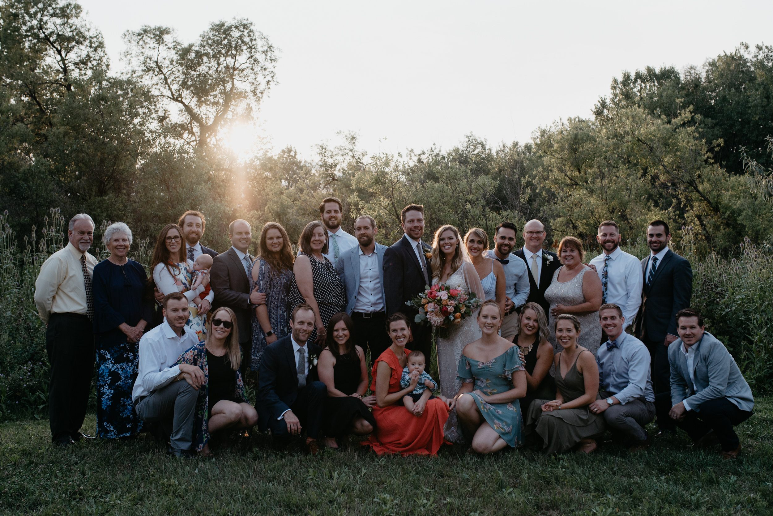  Entire group shot of all guests at wedding. Boulder, Colorado wedding and elopement photographer. Wedding at Three Leaf Farm. 