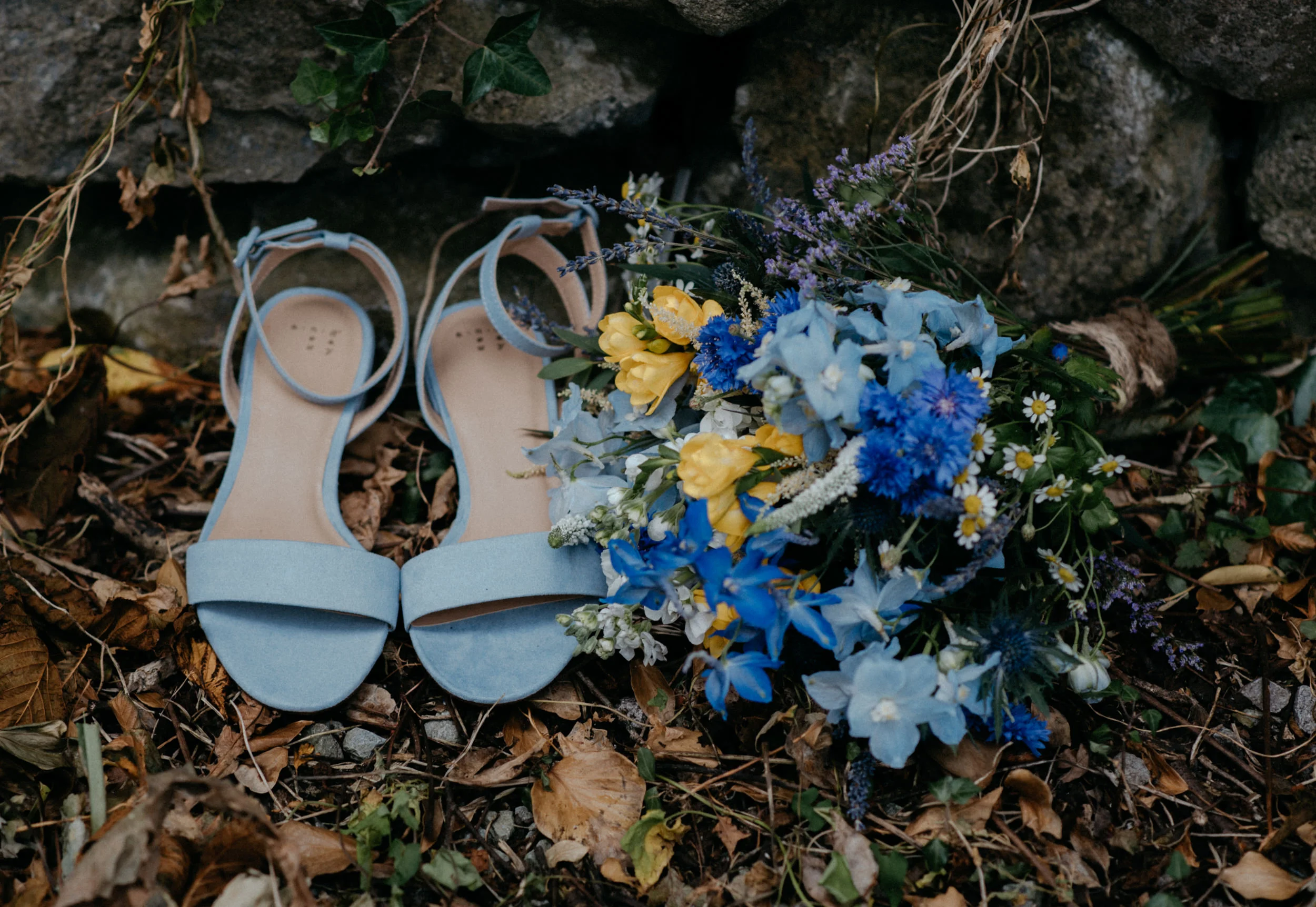  Bride’s shoes and bouquet at Ireland destination wedding at Newtown Castle. County Clare, Ireland wedding and elopement photographer. 