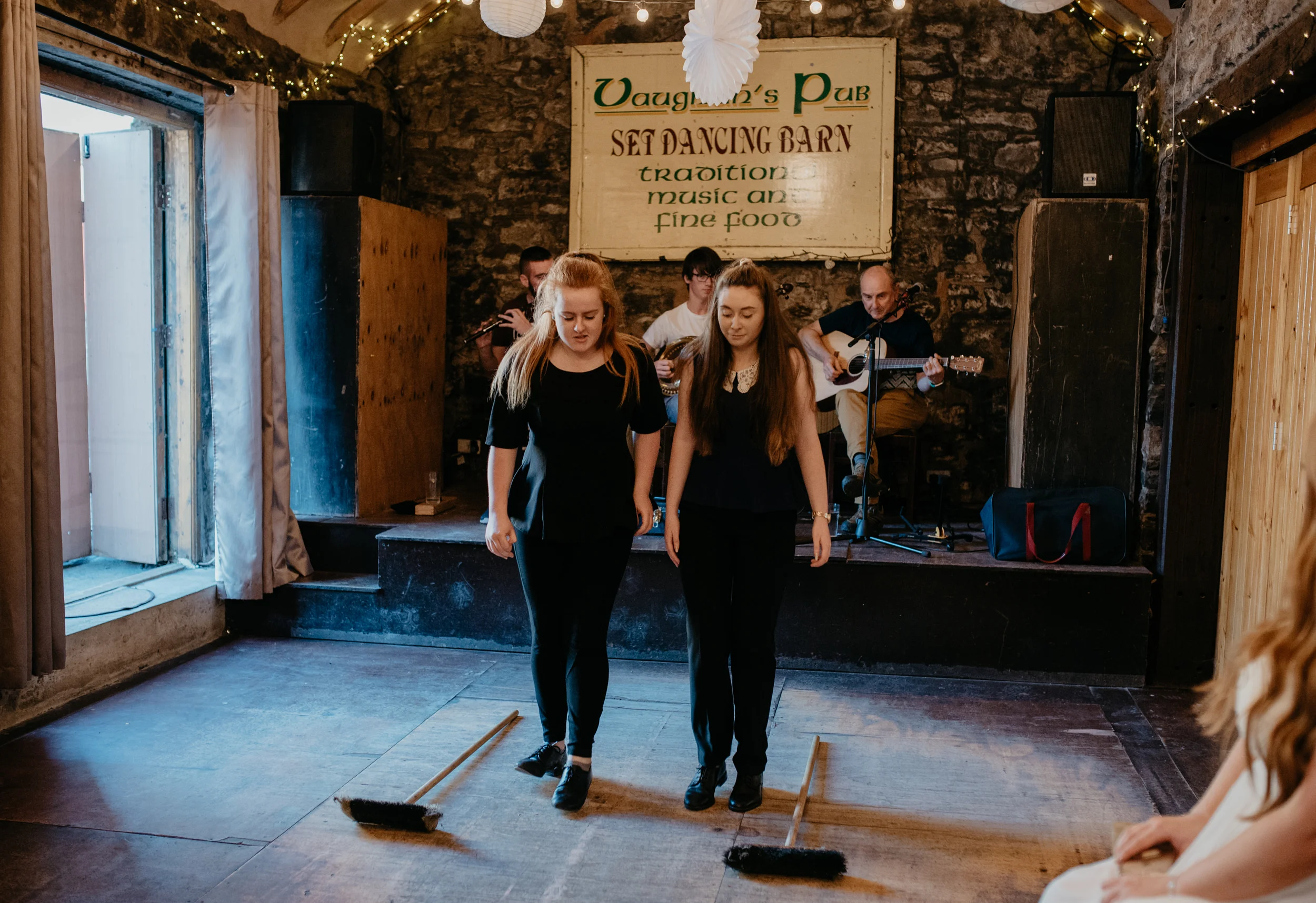  Ireland destination wedding photos. Reception at Vaughan’s Pub in Kilfenora, Ireland. Newtown Castle wedding. County Clare wedding and elopement photographer. Cliffs of Moher elopement.  