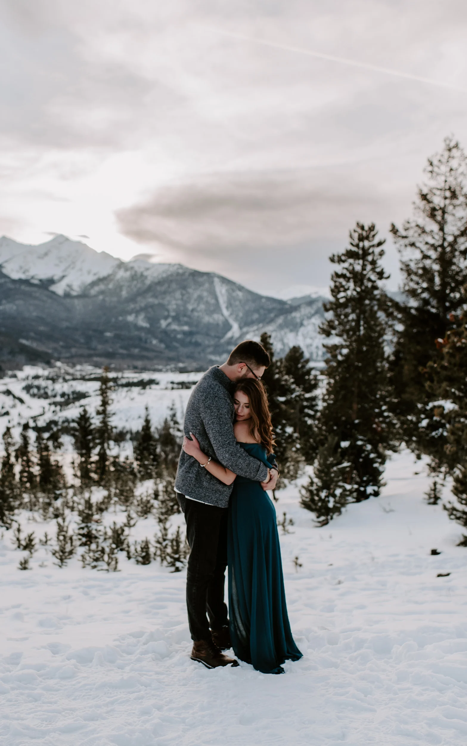  Sunset engagement session photos at Sapphire Point Overlook. Lake Dillon engagement photos. Breckenridge, Colorado winter engagement session photographer. 