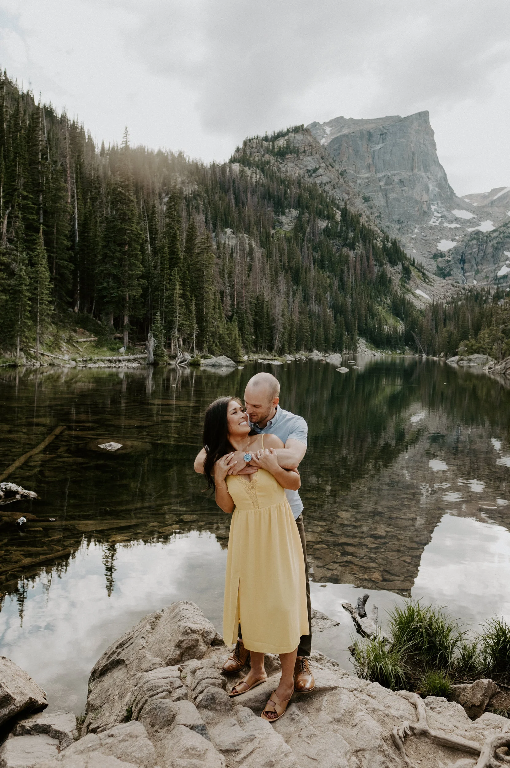  Rocky Mountain National Park hiking engagement session at Dream Lake. Dream Lake sunset engagement photos.. Colorado wedding photographer. Estes Park elopement photographer. Rocky Mountain National Park engagement photos. Colorado adventure engagement photography. Denver wedding photographer. 