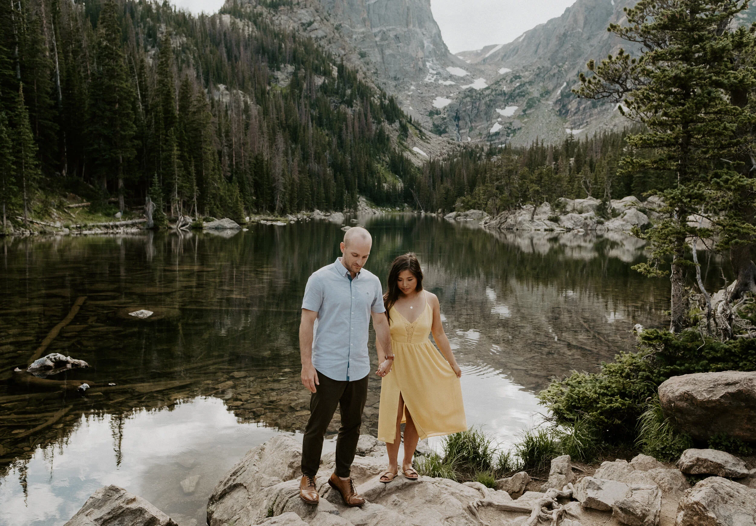  Estes Park, Colorado engagement session. Dream Lake engagement photos in Rocky Mountain National Park. Sunset engagement session at Dream Lake. Estes Park engagement session location ideas. Colorado wedding photographer. Estes Park elopement photography. Rocky Mountain National Park engagement photos. Colorado adventure engagement photography. 