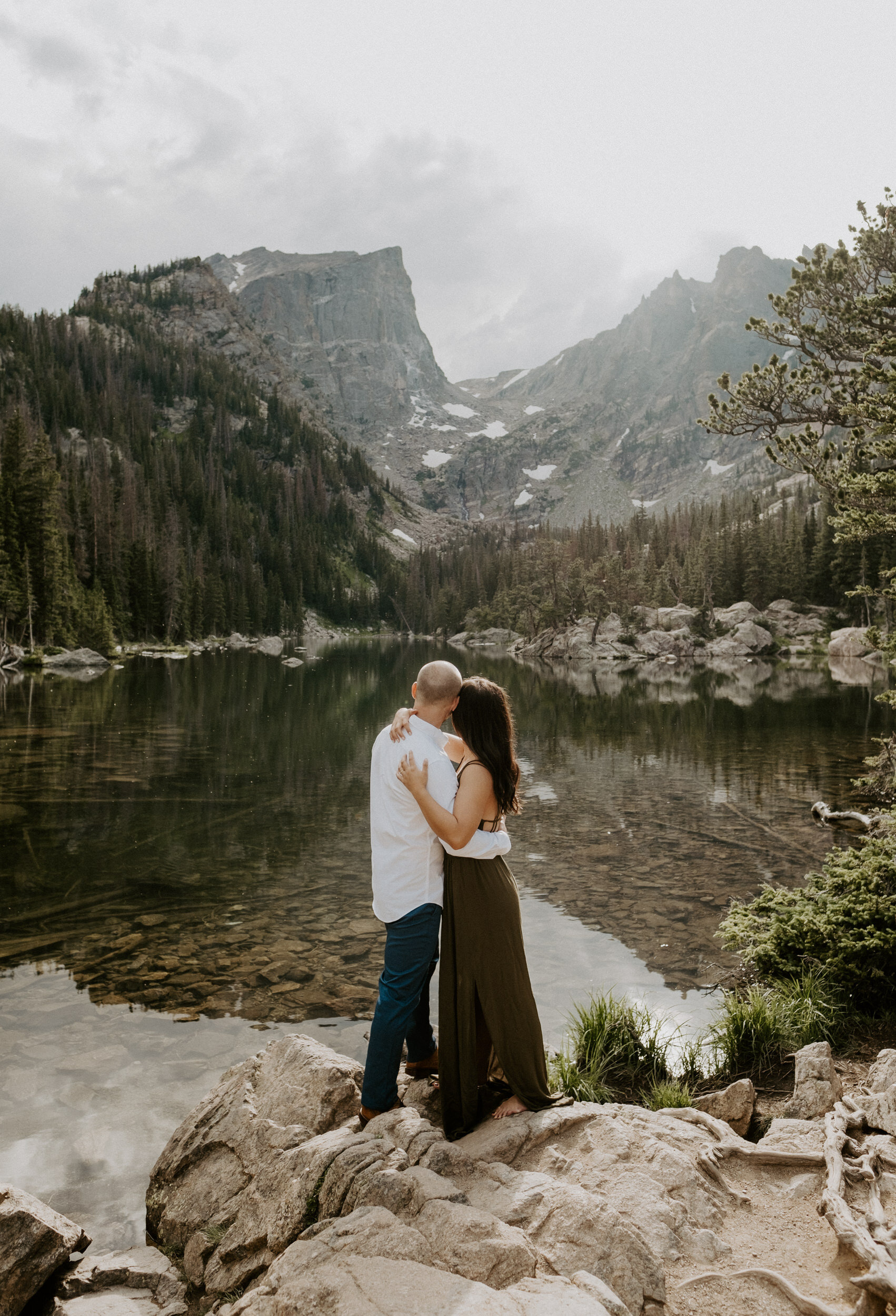  Engagement photos at Dream Lake in Estes Park. Rocky Mountain National Park hiking engagement session at Dream Lake. Estes Park engagement session location ideas. Colorado wedding photographer. Estes Park elopement photographer. Rocky Mountain National Park engagement photo ideas. Colorado adventure engagement photography. 