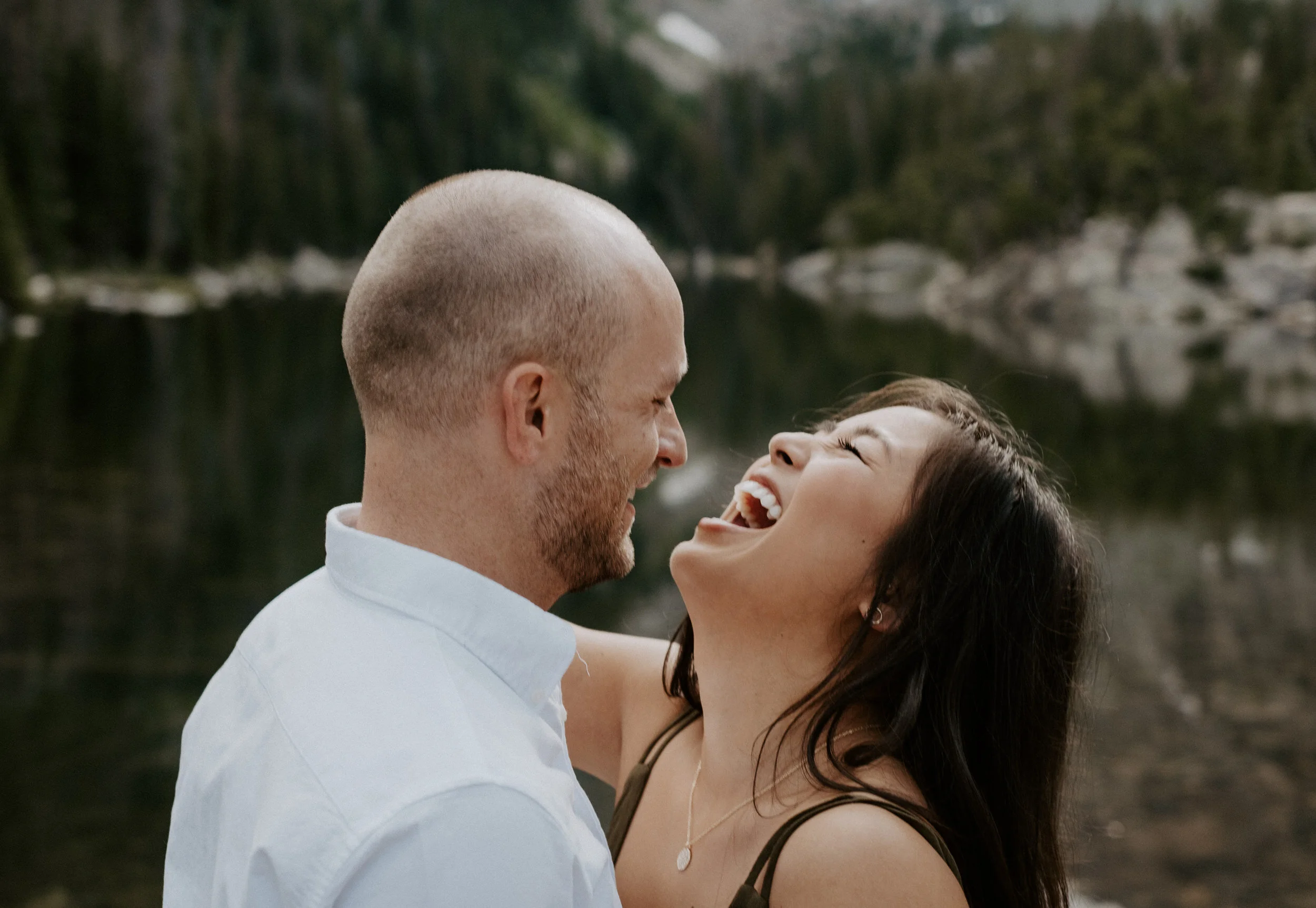 Estes Park, Colorado engagement session photographer. Colorado adventure elopement photographer. Sunset engagement photos at Dream Lake. Dream Lake in Rocky Mountain National Park adventure engagement photos. Colorado wedding and elopement photographer. 