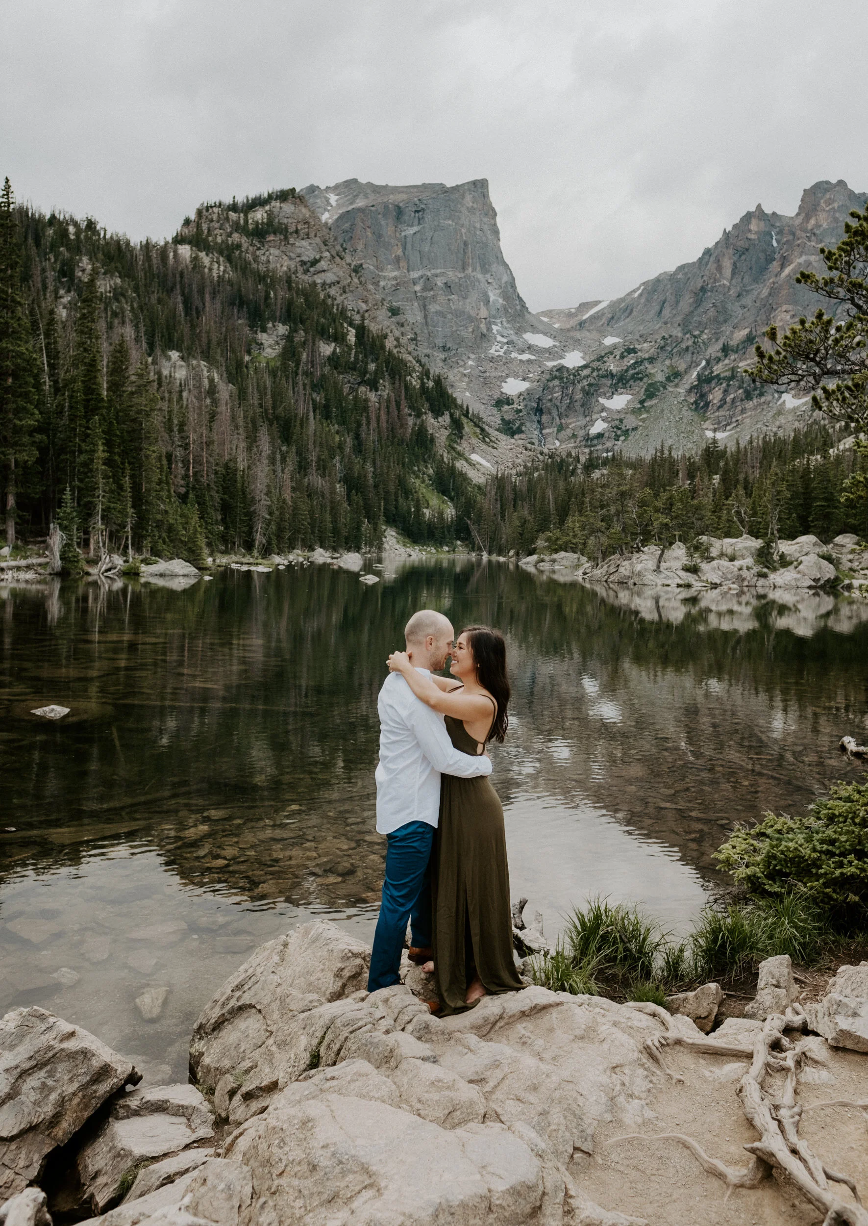  Colorado engagement session location ideas. Estes Park, Colorado engagement session photographer. Sunset engagement photos at Dream Lake. Dream Lake in Rocky Mountain National Park adventure engagement photos. Colorado wedding and elopement photographer. 