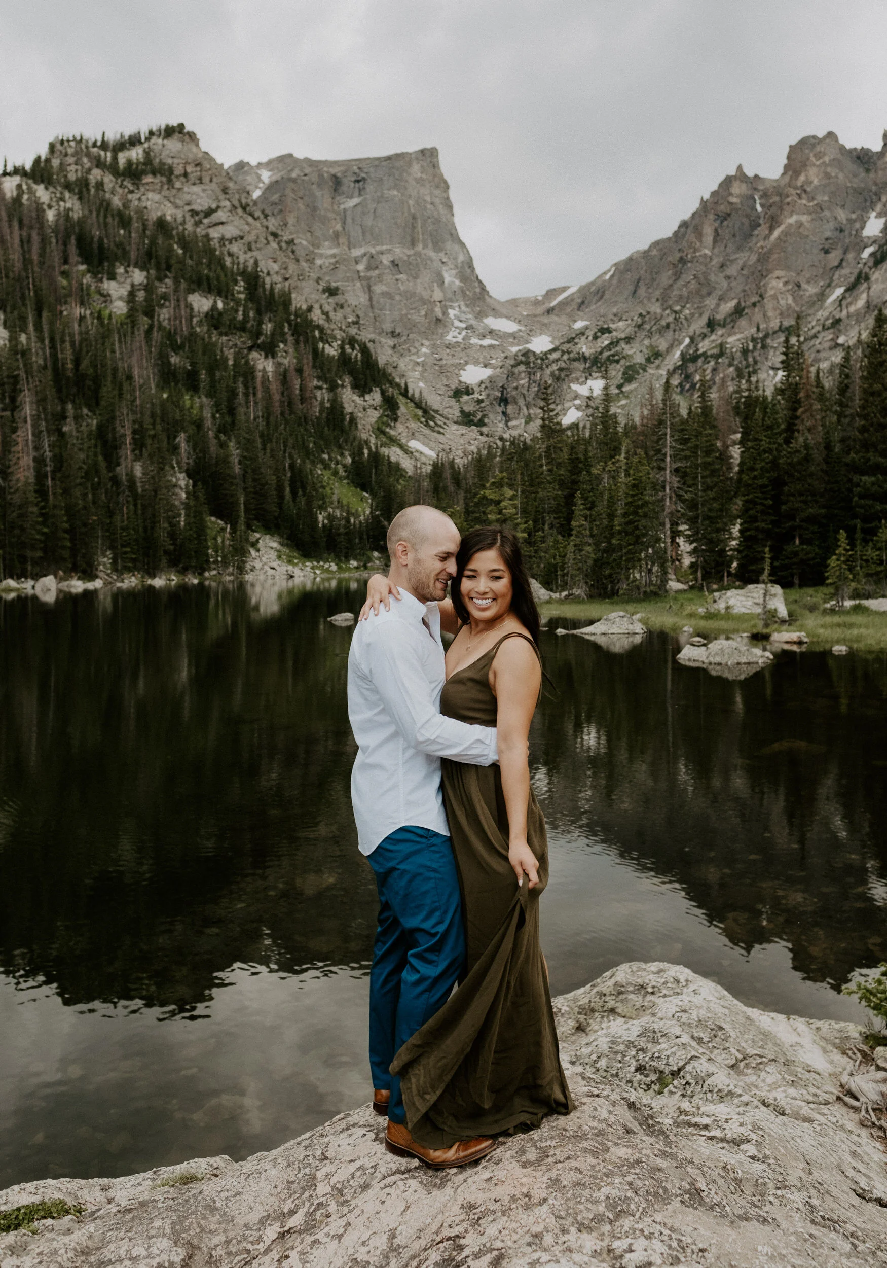  RMNP engagement photos. Estes Park, Colorado engagement session photographer. Sunset engagement photos at Dream Lake. Dream Lake in Rocky Mountain National Park adventure engagement photos. Colorado wedding and elopement photographer. 